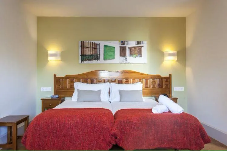 Bed in Hotel Alcadima