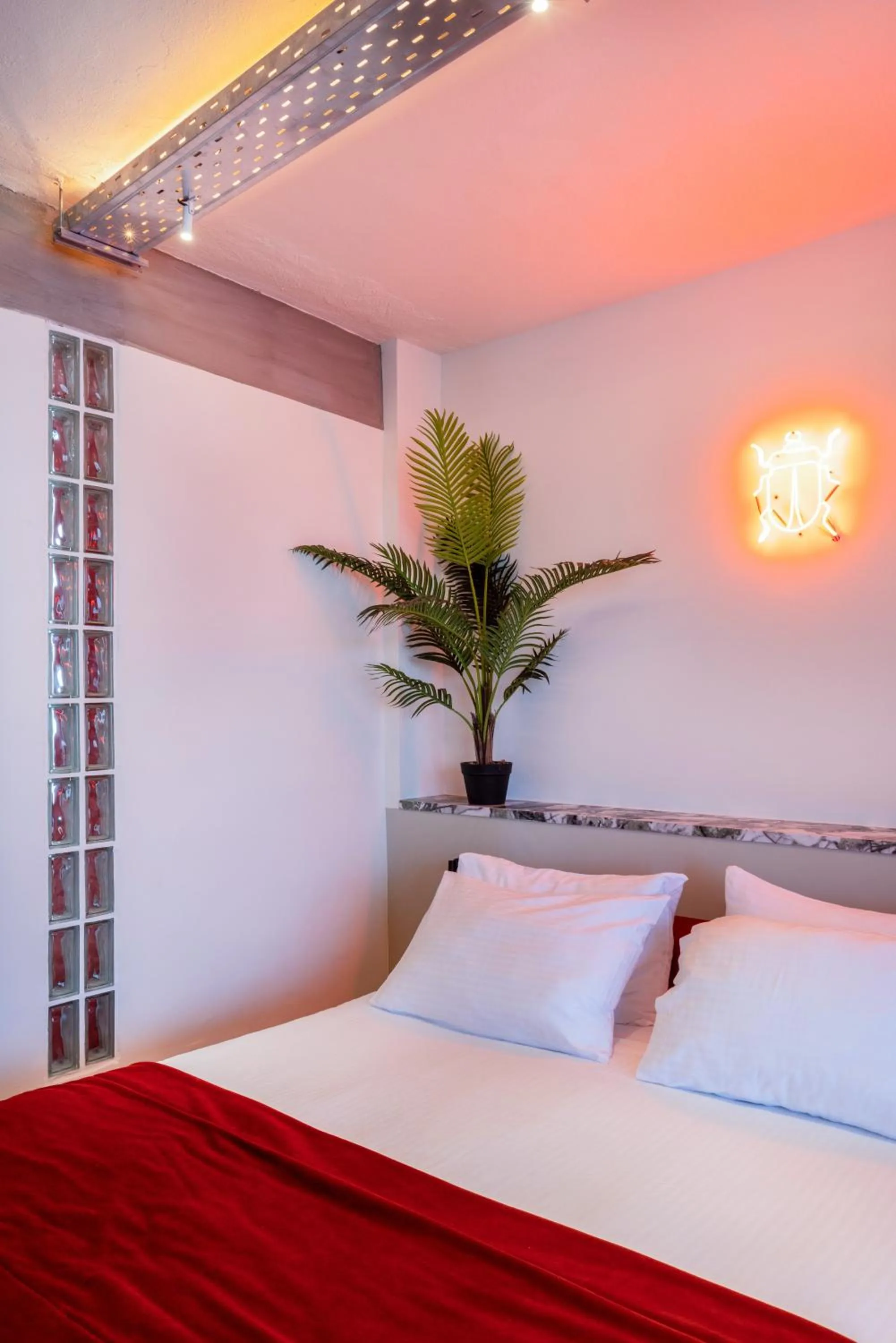 Bed in The Newel Metaxourgeio by Athens Stay