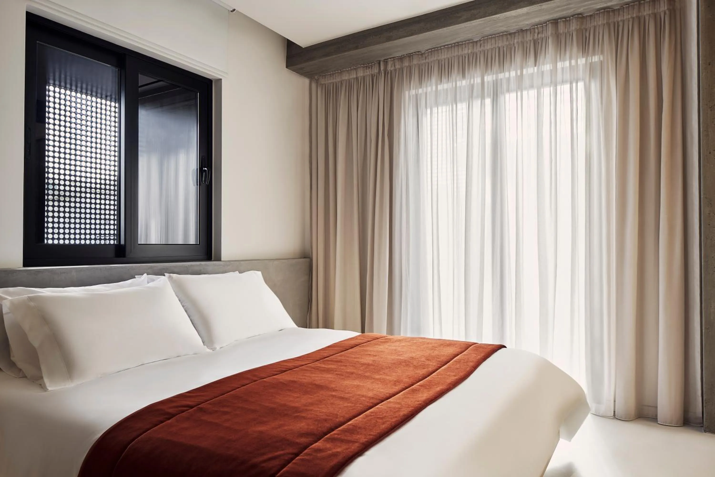 Bed in The Newel Metaxourgeio by Athens Stay