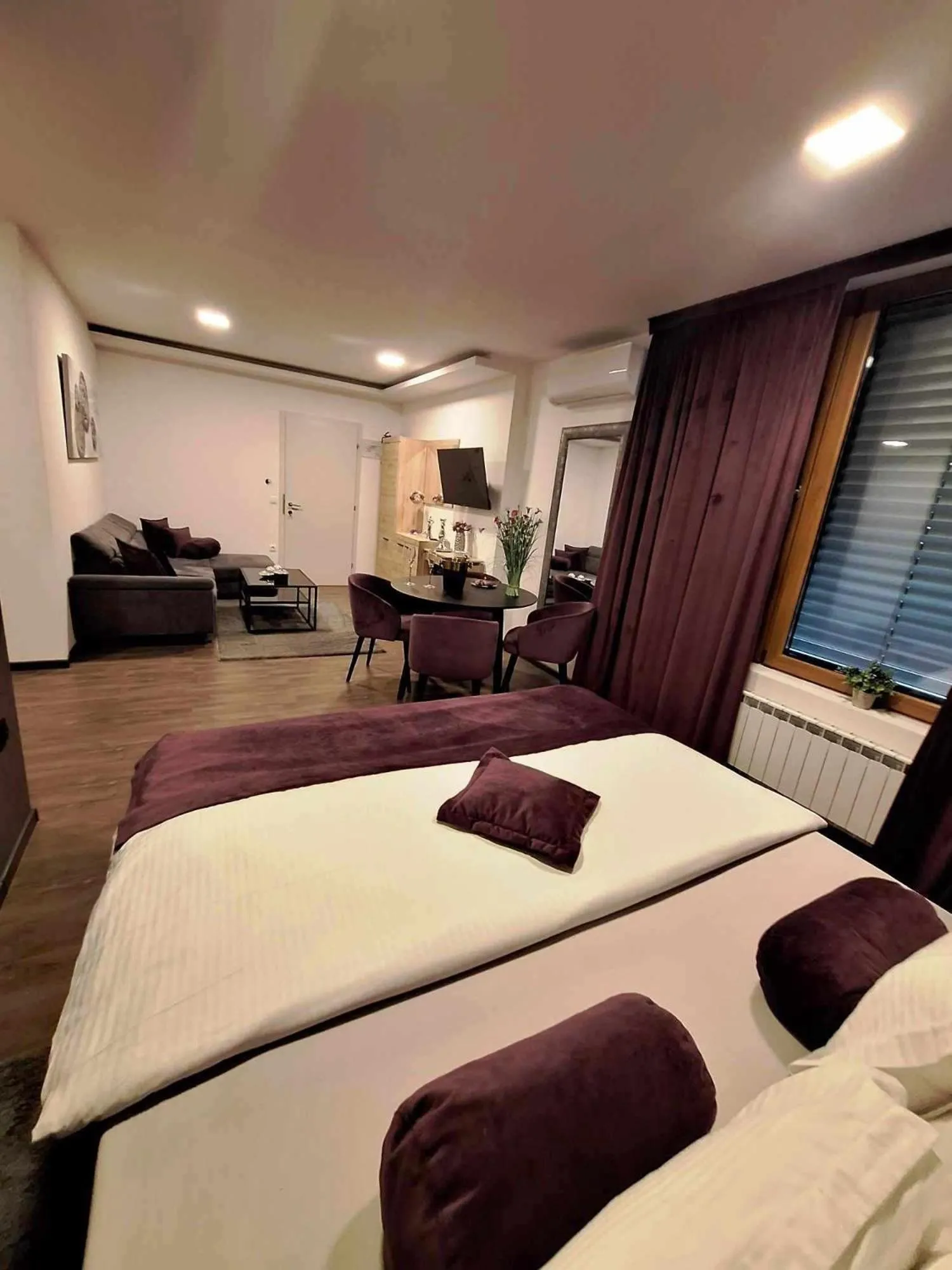 Living room, Bed in Arcobaleno Apartments & Rooms