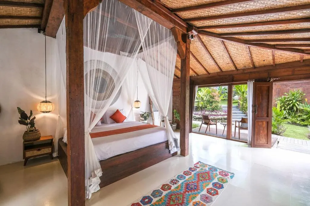 Bed in Kayu Mama Resort and Spa