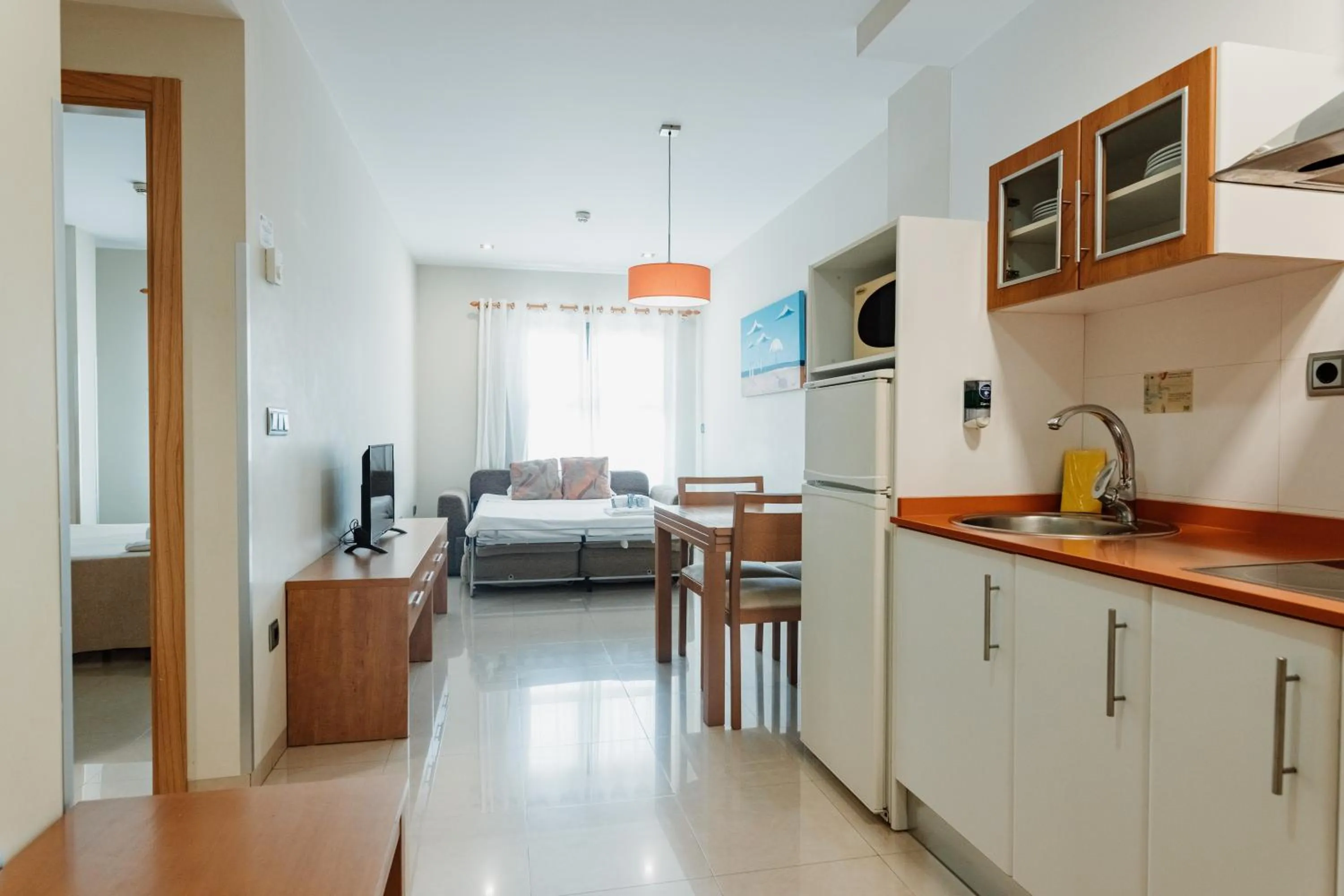 Kitchen or kitchenette, Bed in Aparthotel Bahía