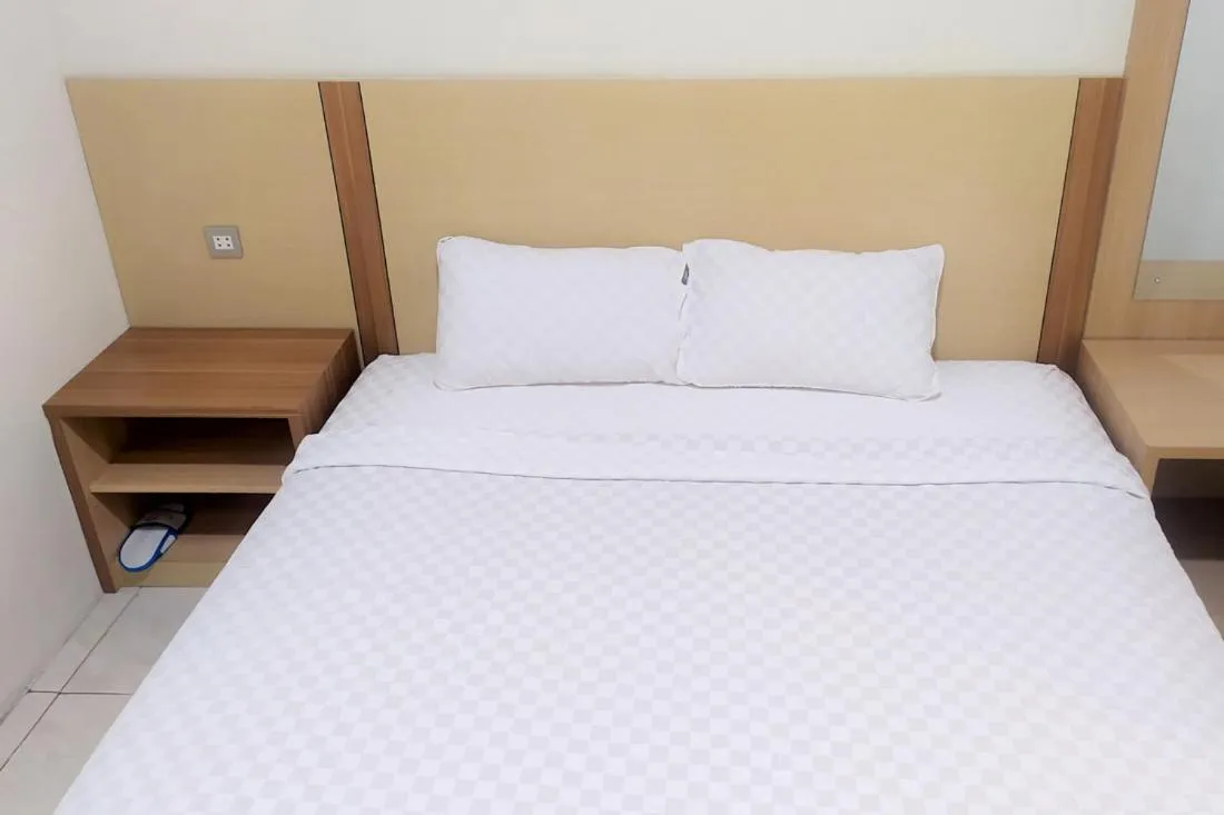 Bed in TwoSpaces Living at Residence 6