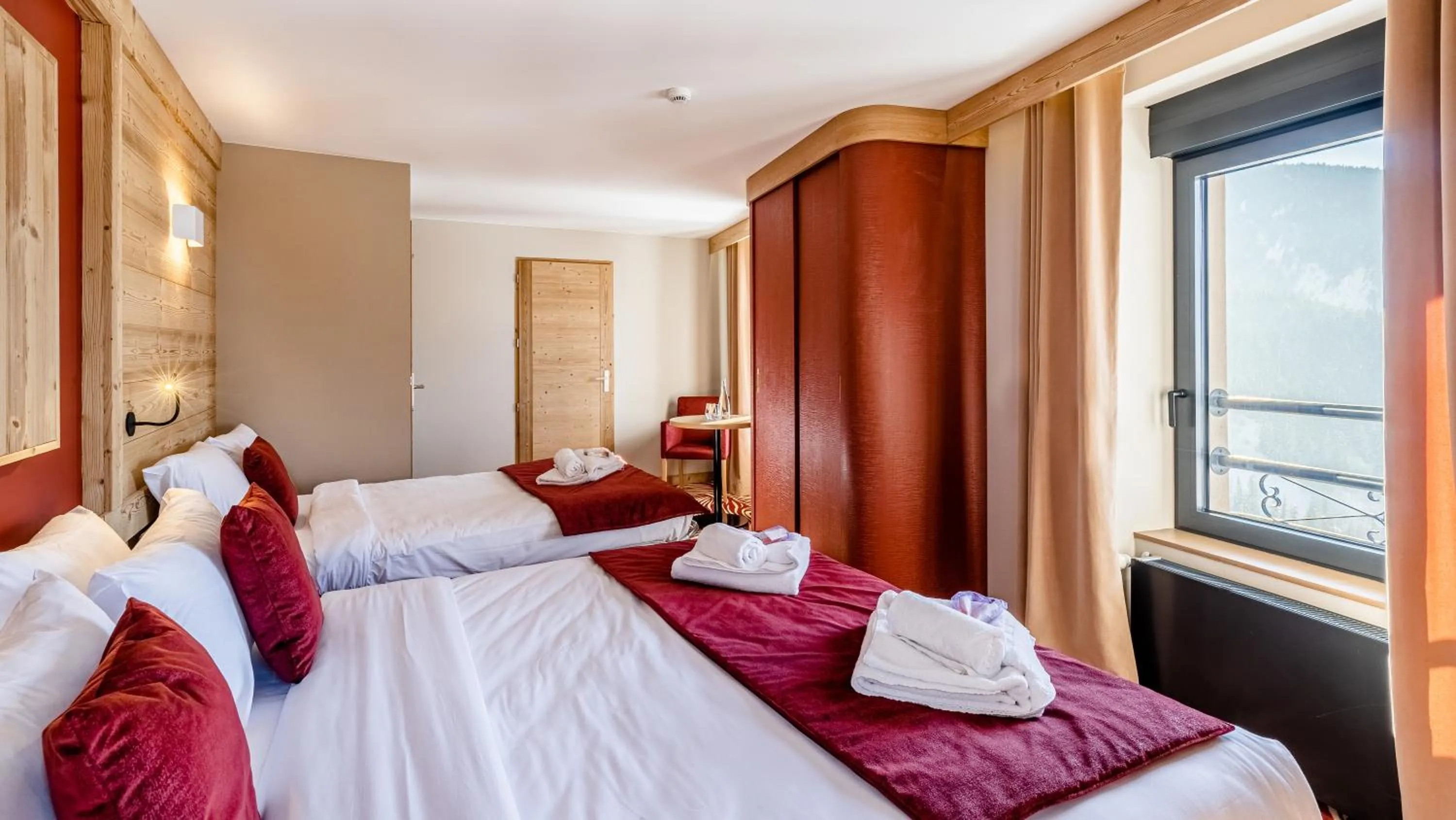 Bed in Madame Vacances Hotel Les Cimes