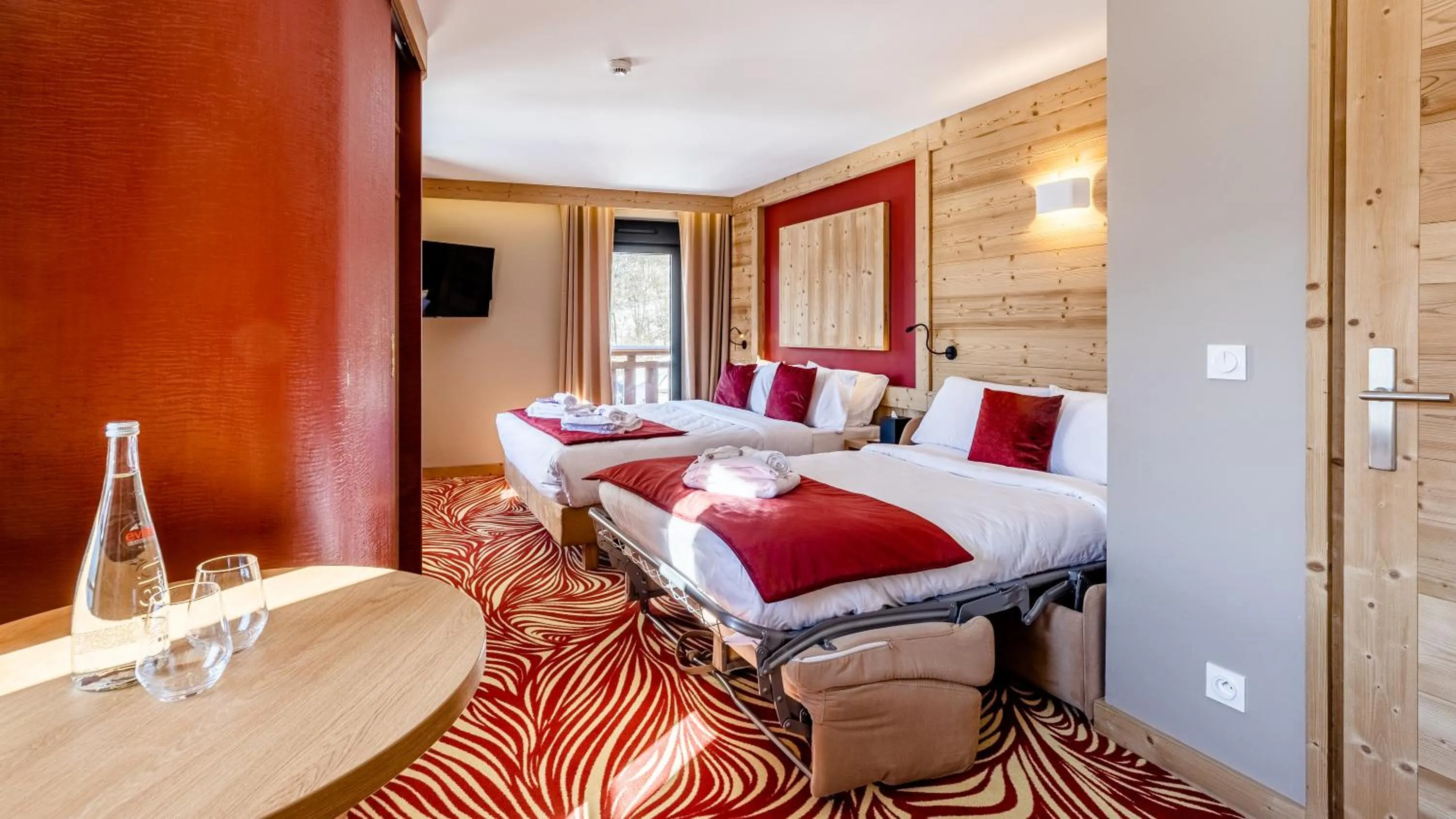 Bed in Madame Vacances Hotel Les Cimes