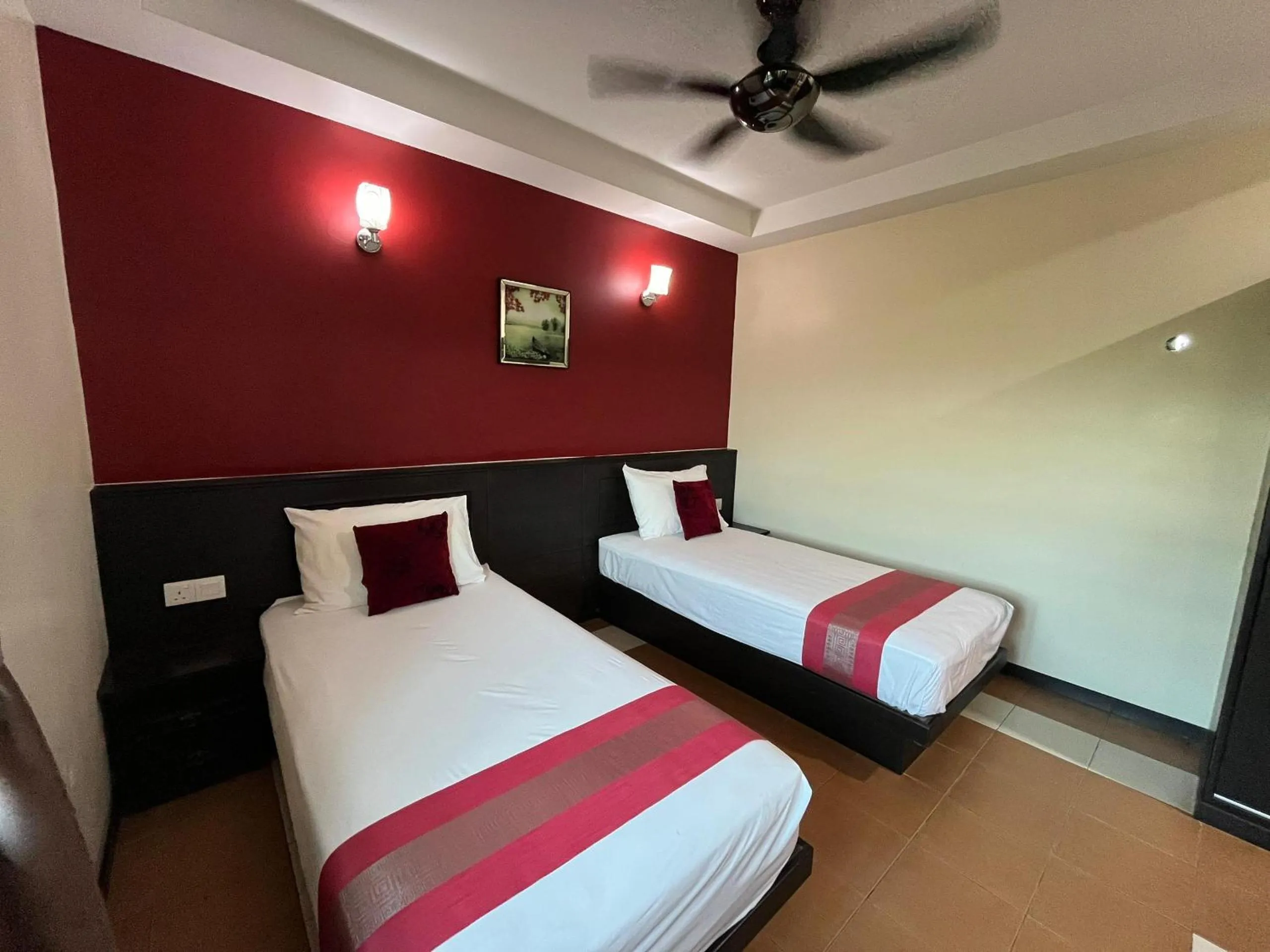 Bed in Sera Sentosa Inn