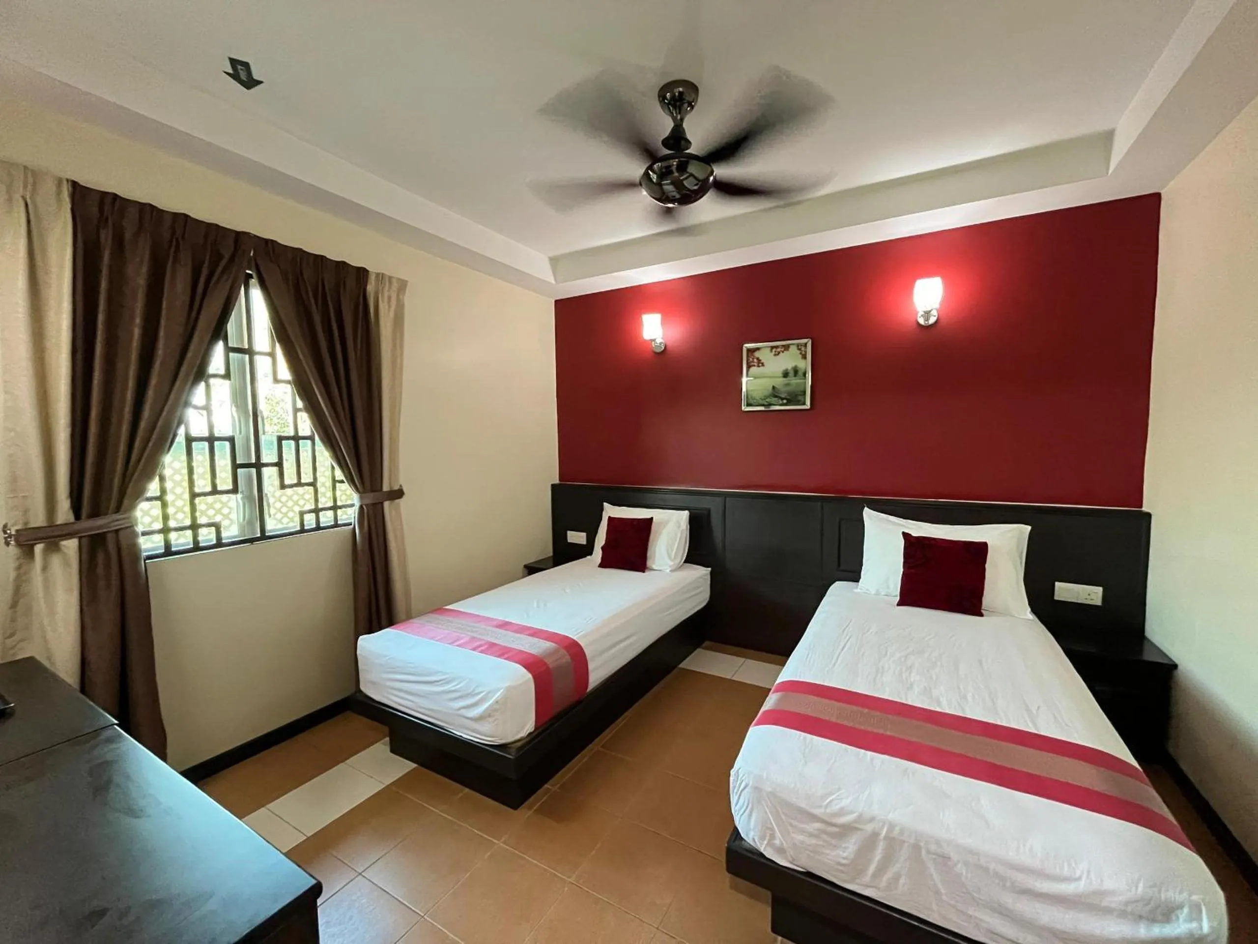 Bed in Sera Sentosa Inn