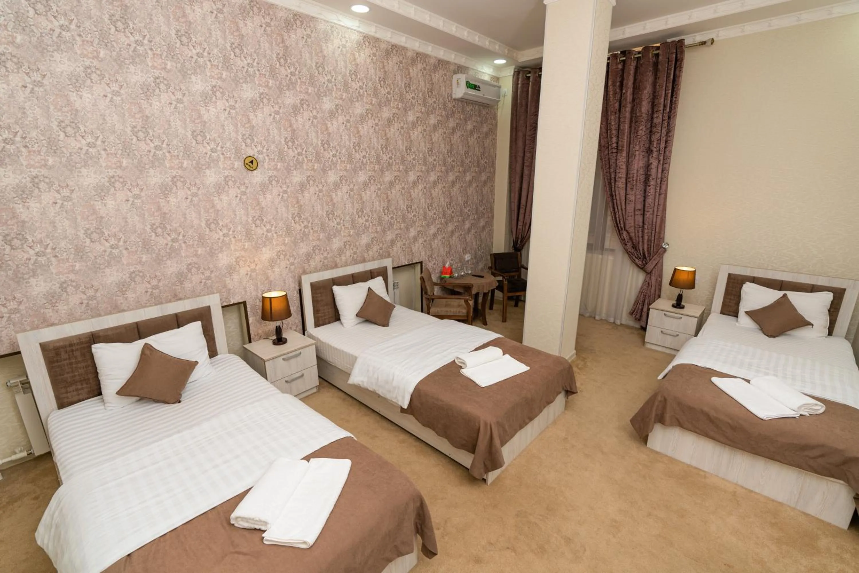 Bed in Osiyo Plaza Hotel