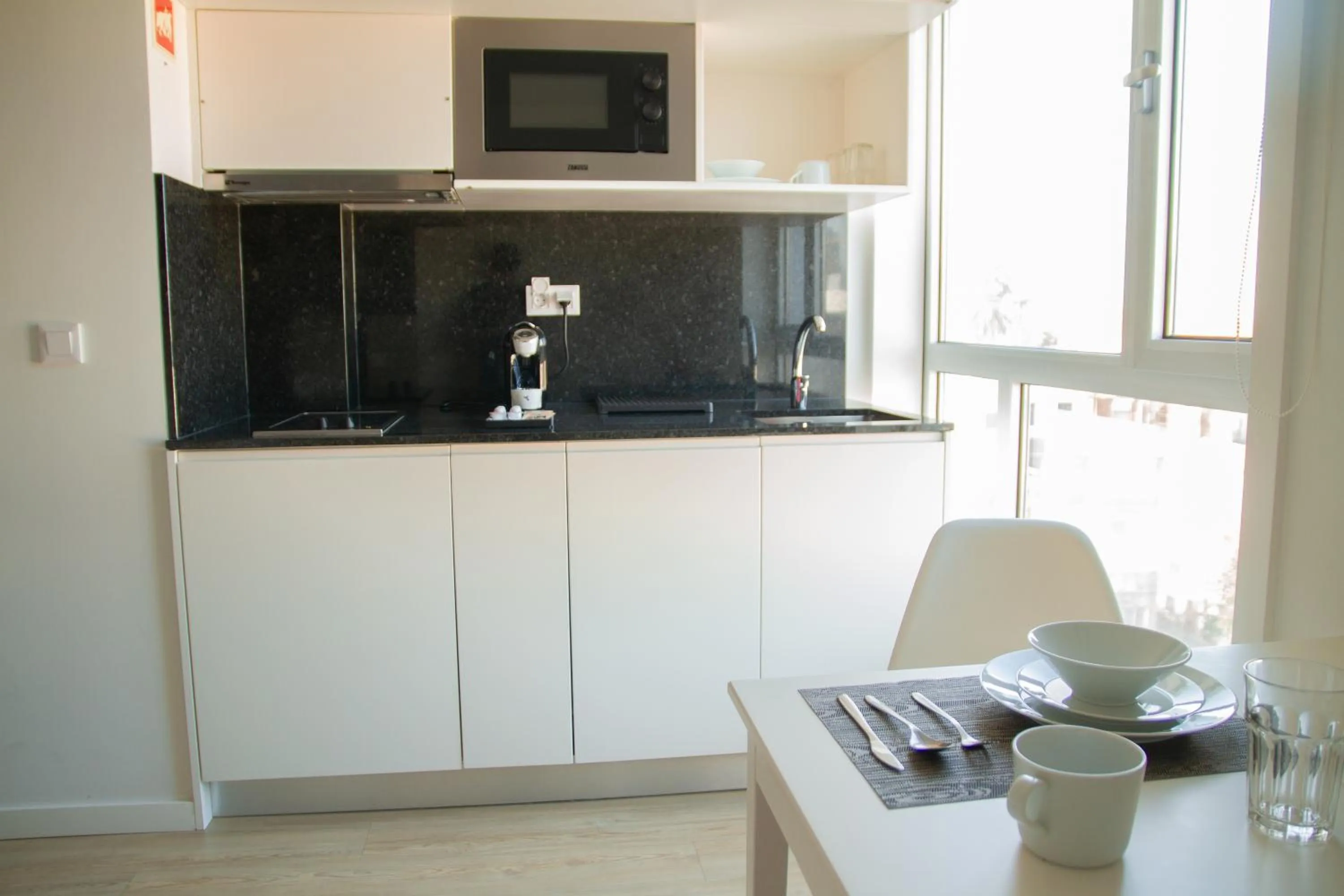 Kitchen or kitchenette in room Select Porto Suites
