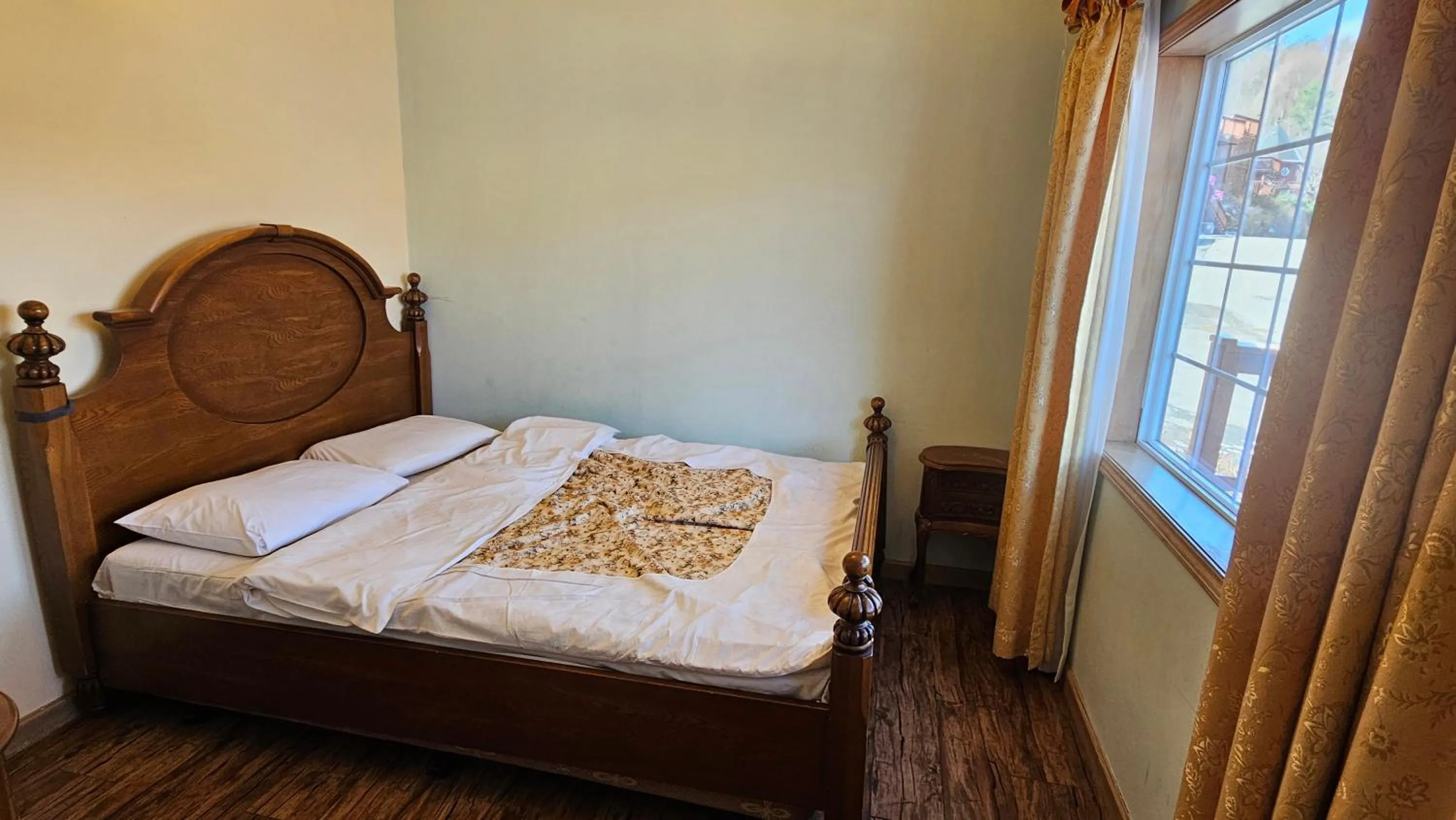 Bed in Elf Resort Hotel