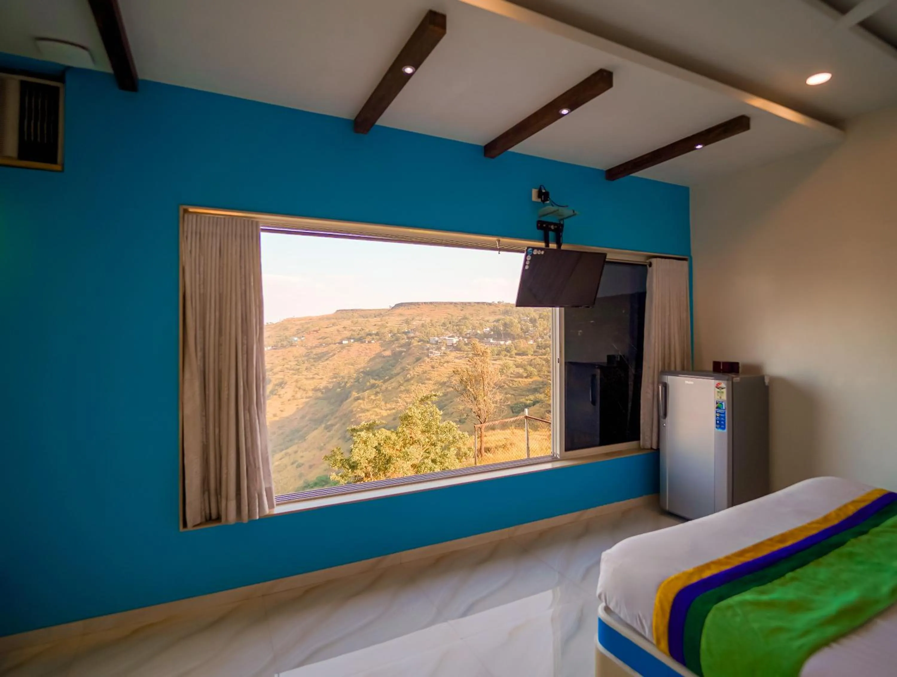Bedroom in Treebo Raval Resort with Valley View