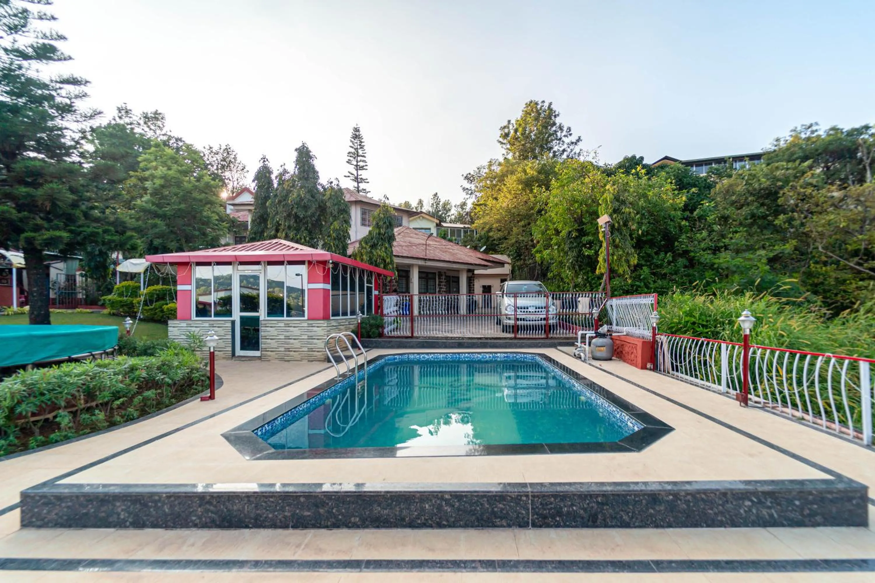 Swimming pool in Treebo Raval Resort with Valley View