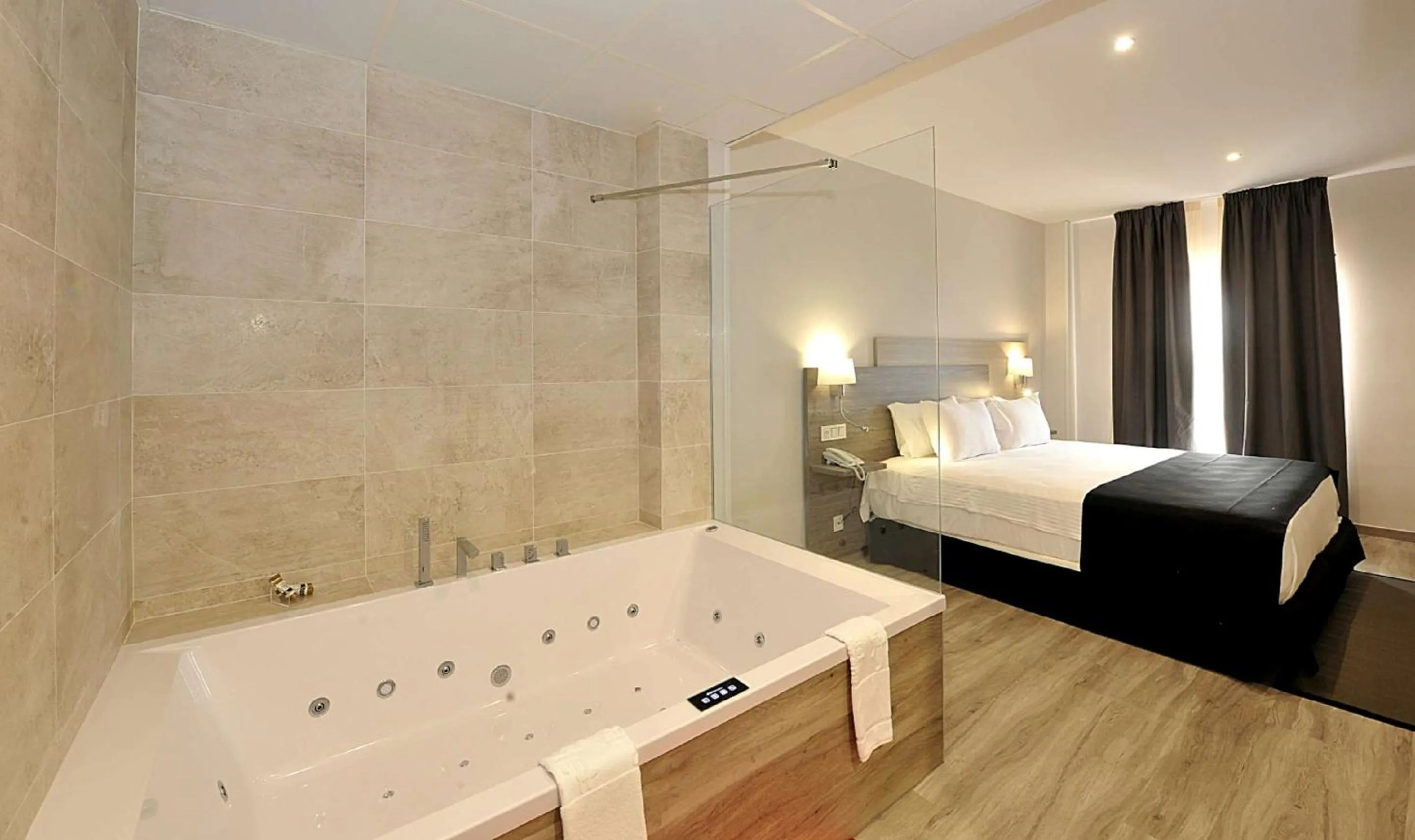 Photo of the whole room, Bed in Hotel Salobreña Suites