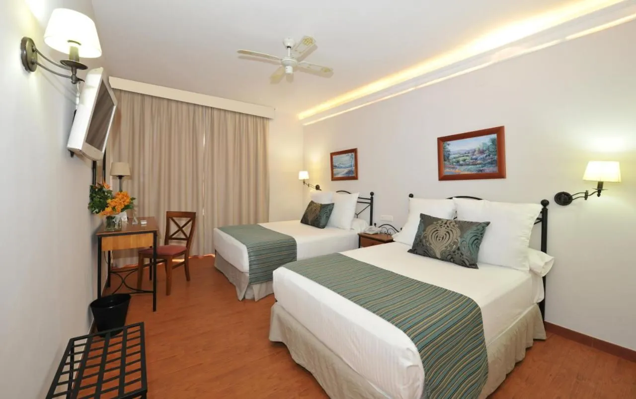 Bed in Hotel Salobreña Suites