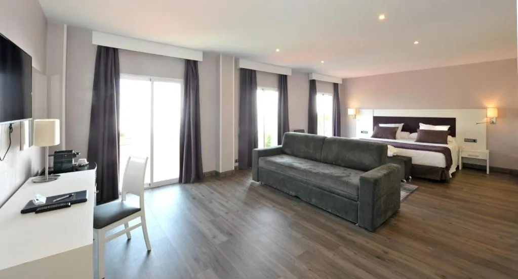 Photo of the whole room, Bed in Hotel Salobreña Suites