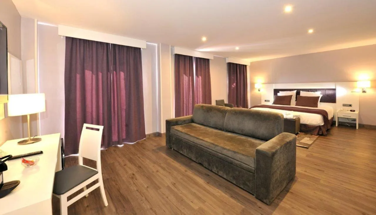 Bed in Hotel Salobreña Suites