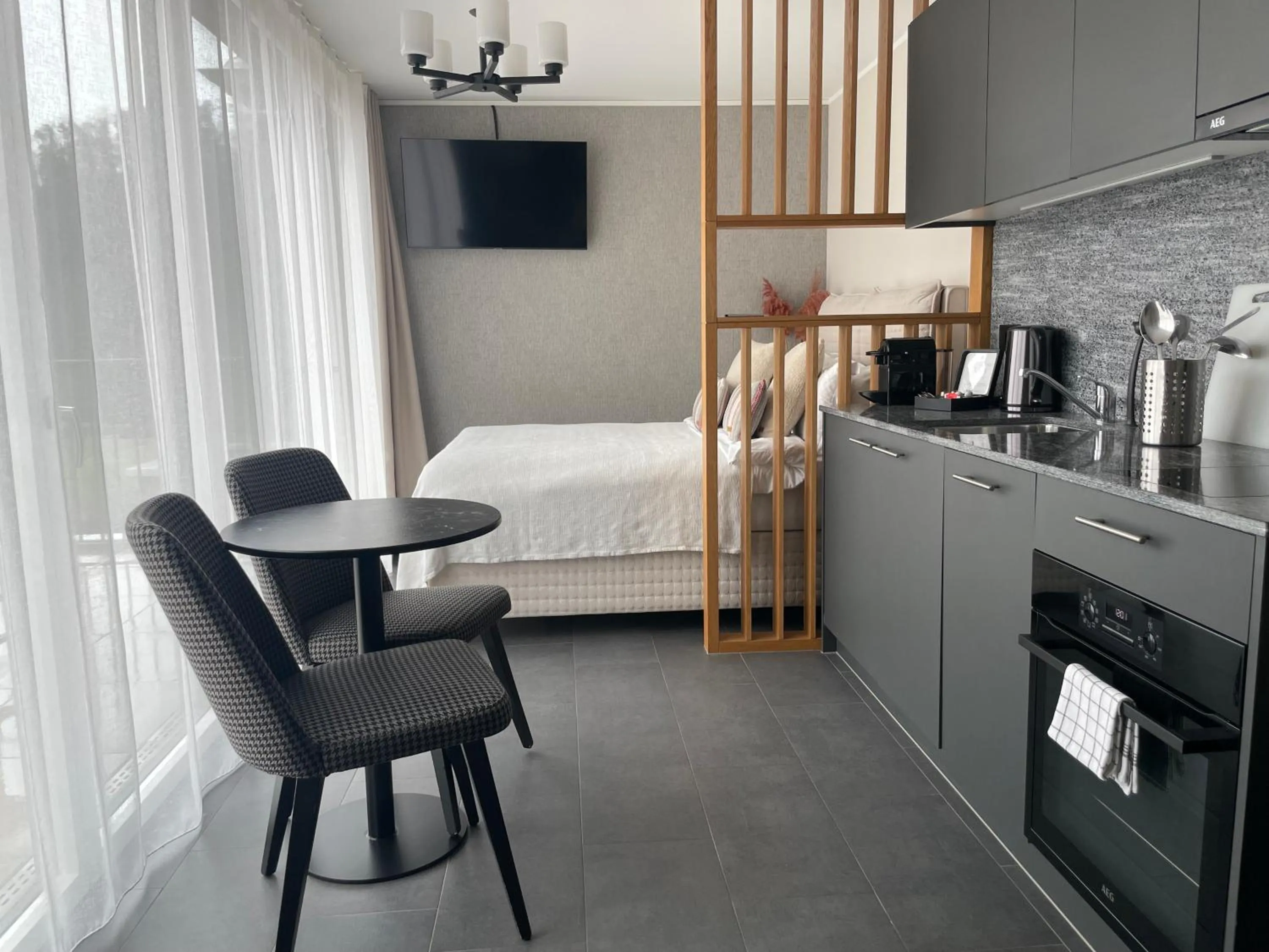 Seating area, Bed in Lamira Serviced Apartments Zurich City