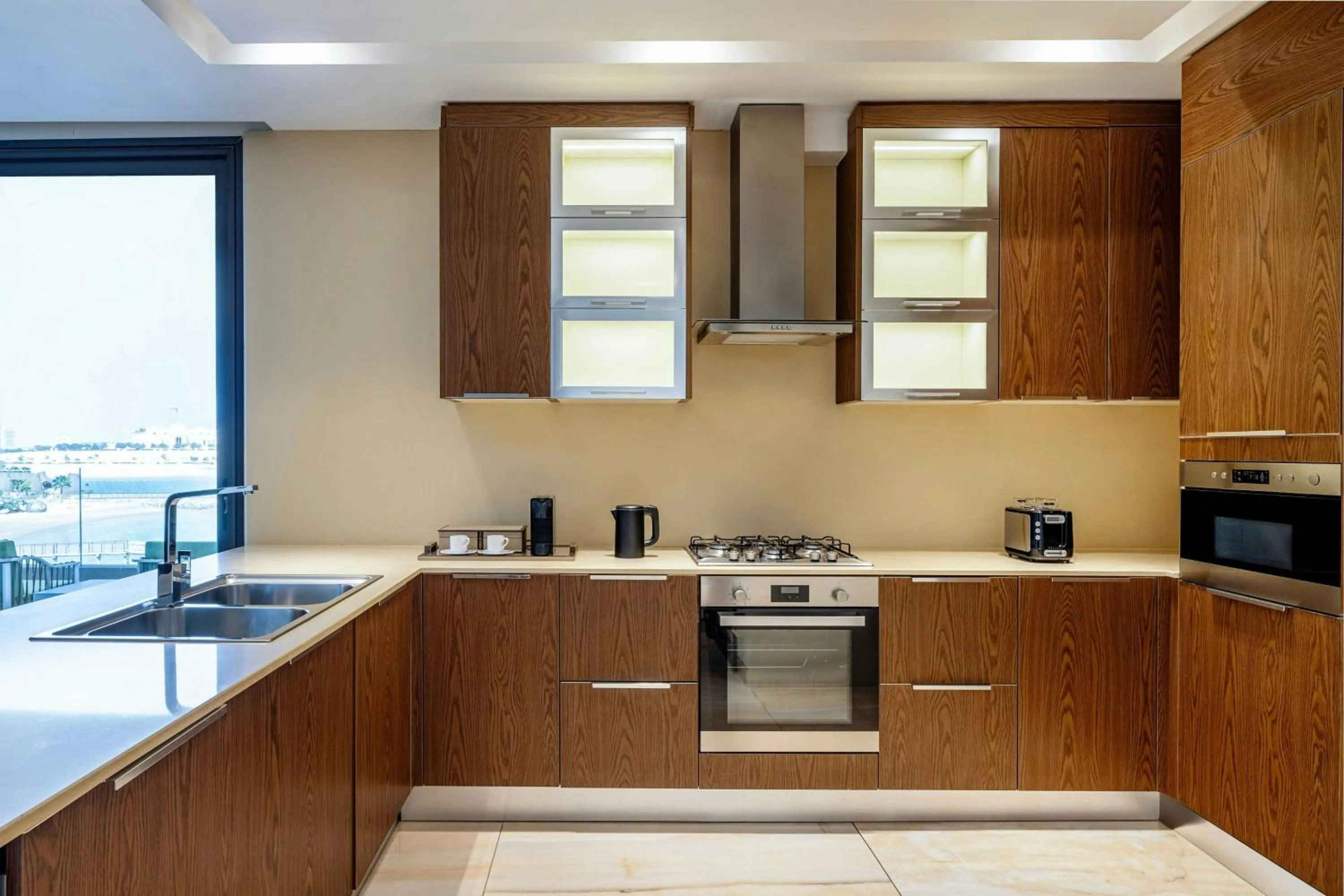 Kitchen or kitchenette in Agora, Doha, Autograph Collection