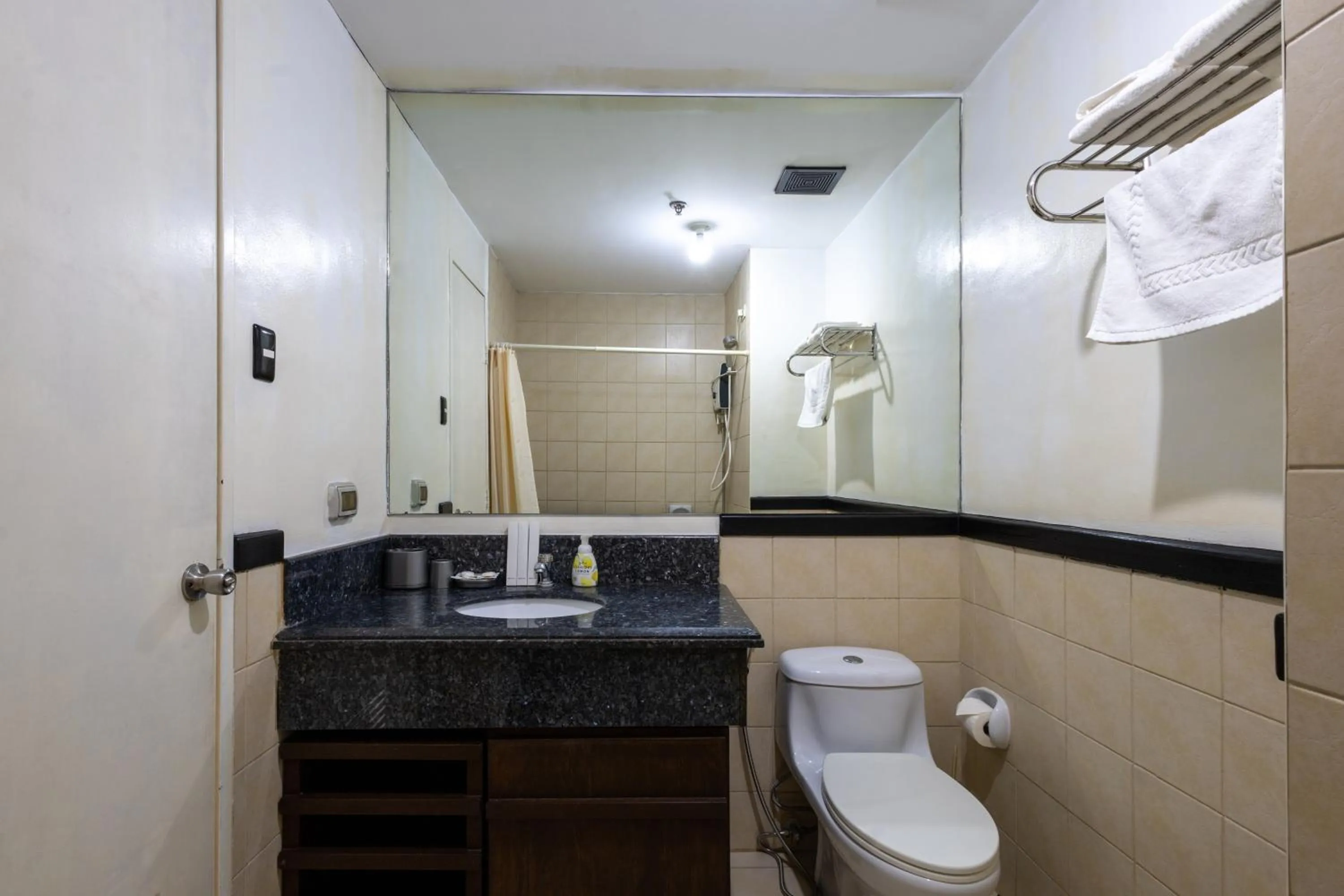 Shower in Spacious Penthouse Near NAIA with 24-7 Convenience