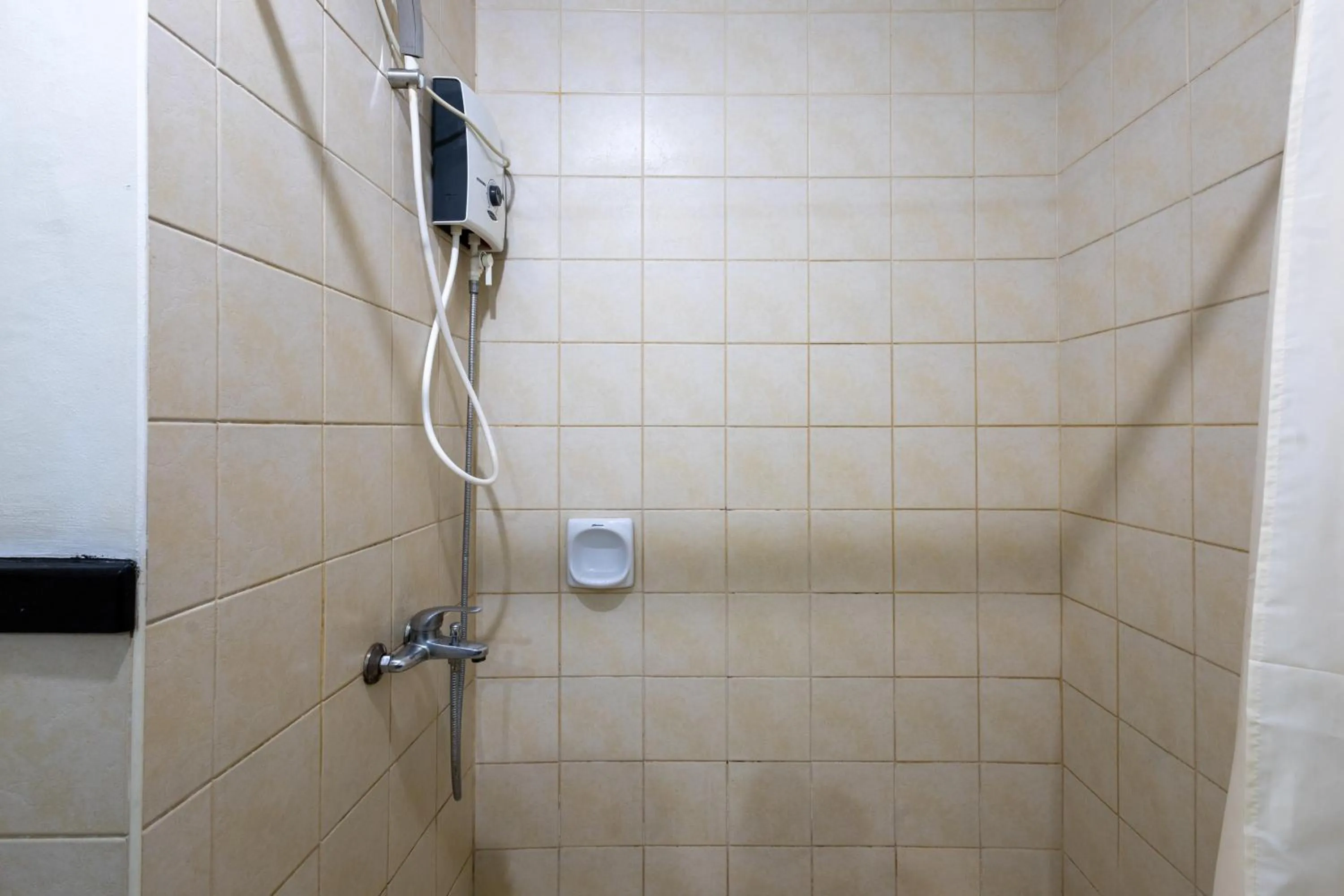 Shower in Spacious Penthouse Near NAIA with 24-7 Convenience