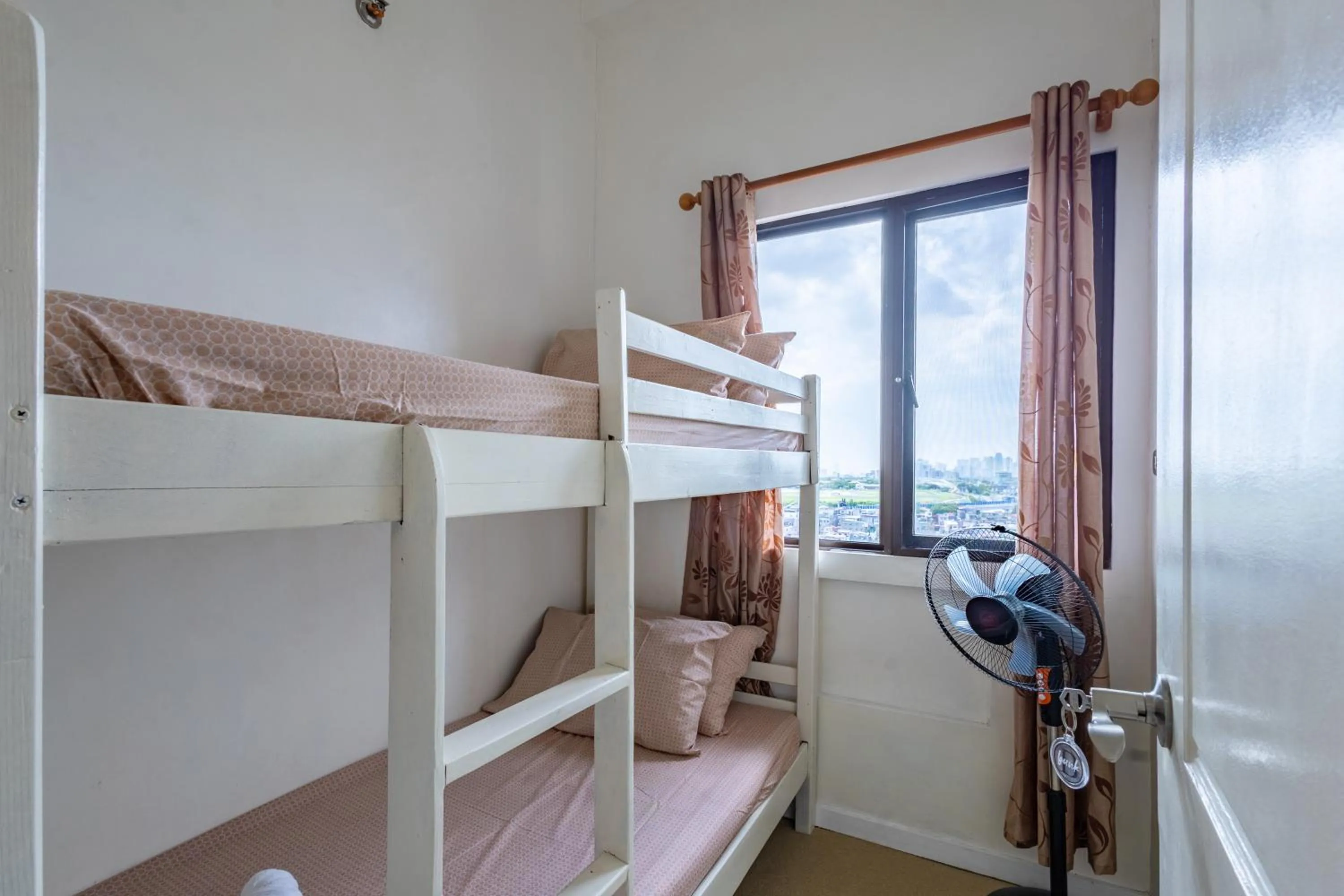 Bed in Spacious Penthouse Near NAIA with 24-7 Convenience