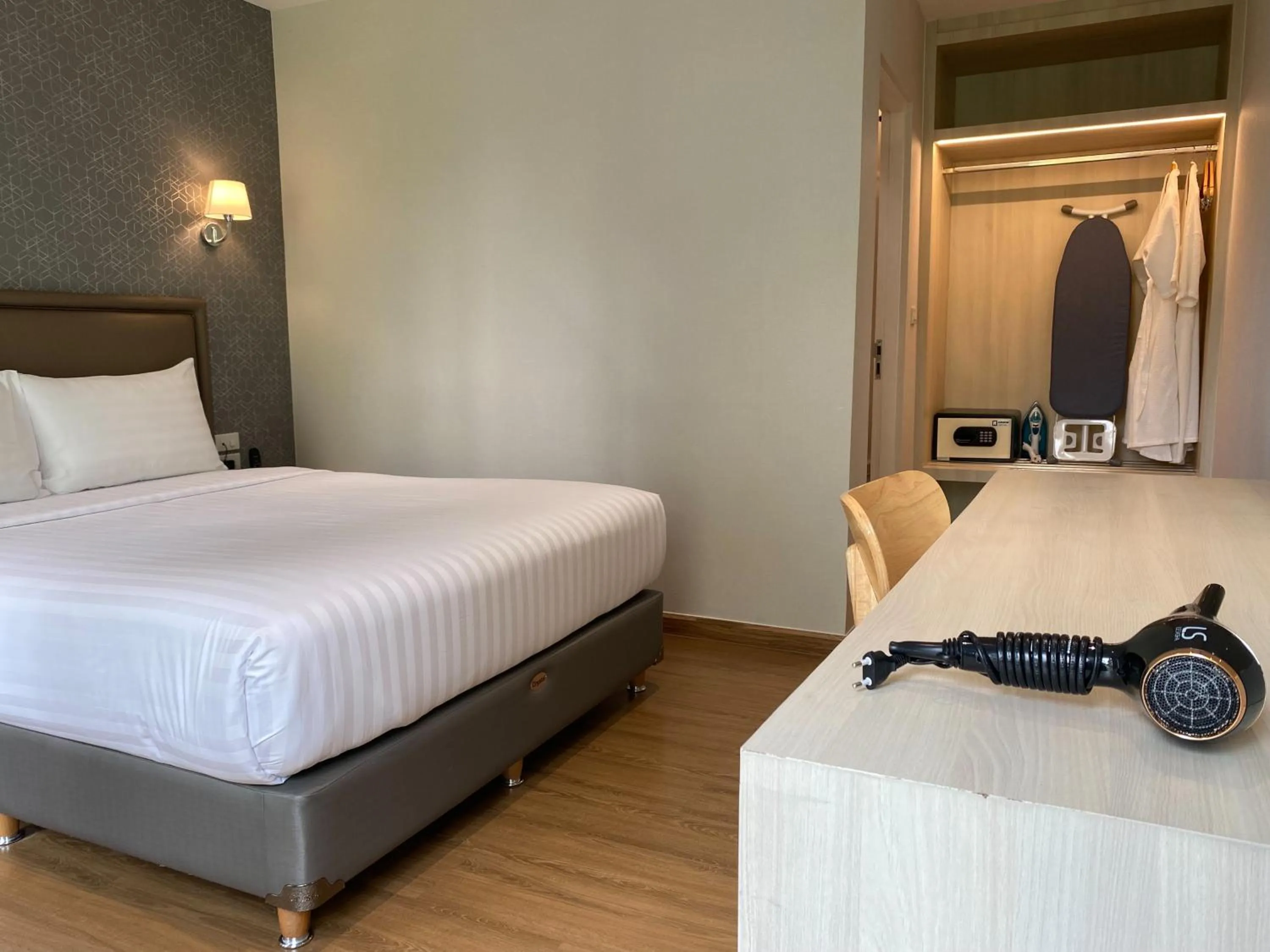 Bed in Lucky Hotel Bangkok