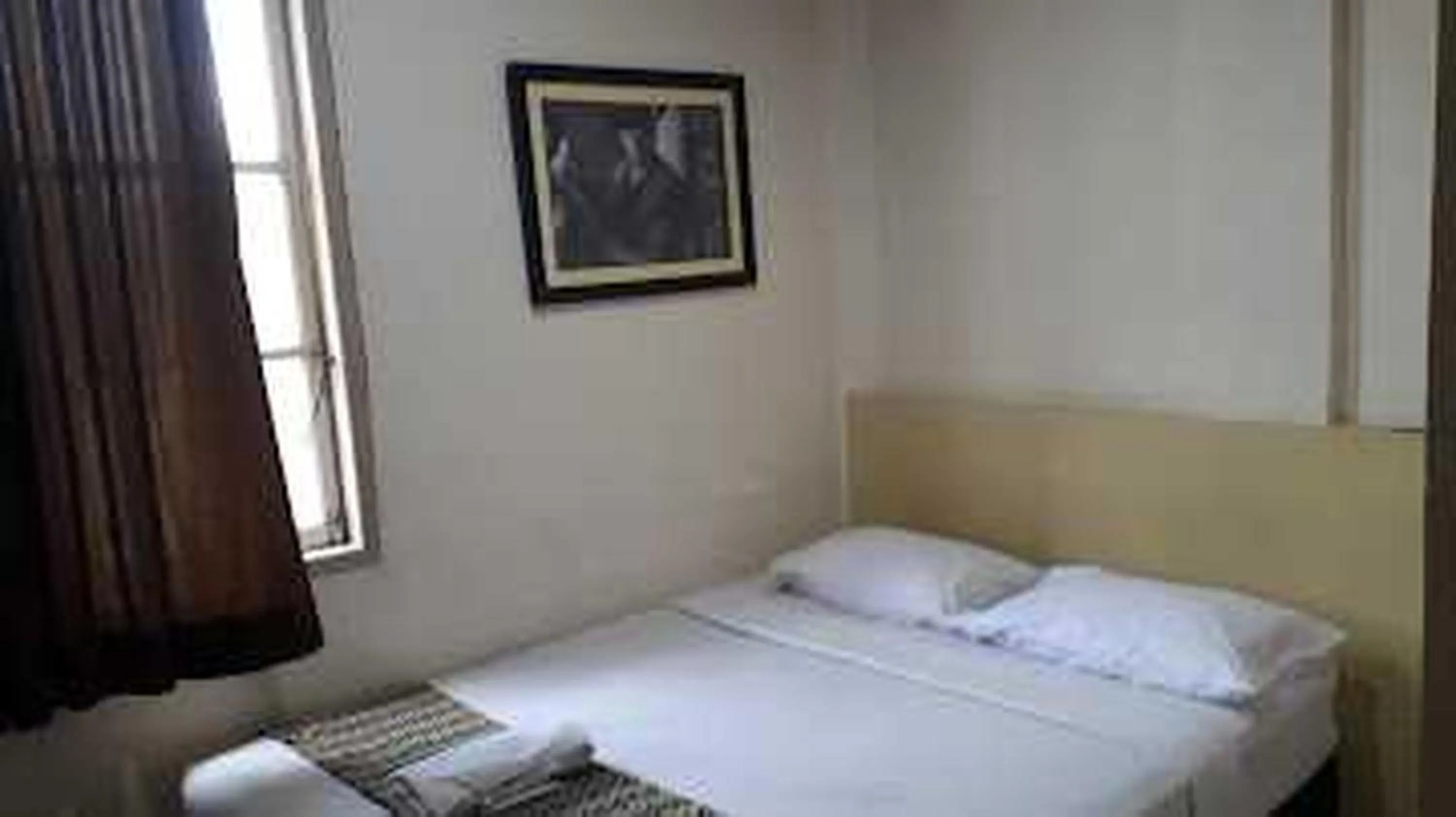 Photo of the whole room, Bed in EXPRESS O 91674 Penginapan Bm Prima