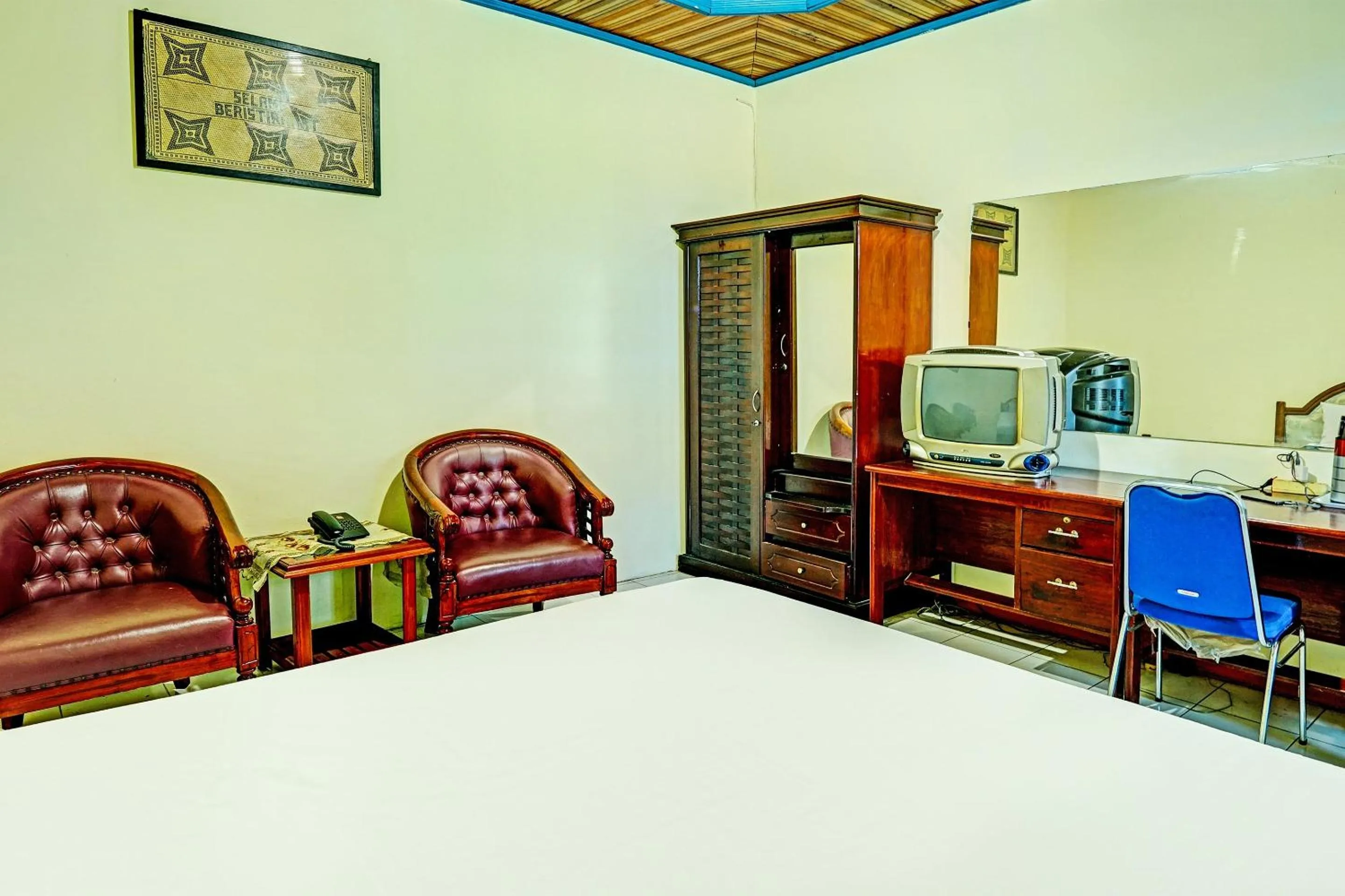 Bedroom in Capital O 91806 Hotel Batu Suli