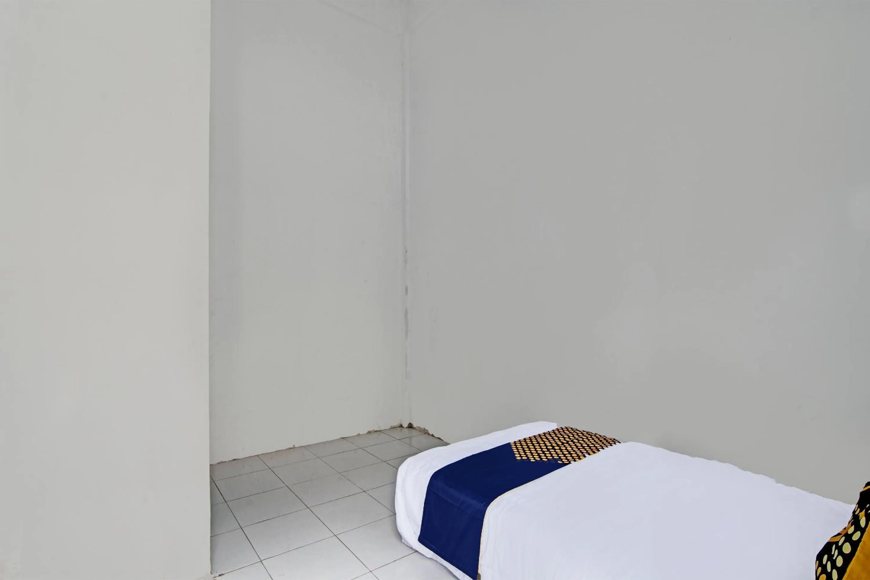 Bedroom in Hotel O Homestay Dinda Syariah Near Masjid Al Amin