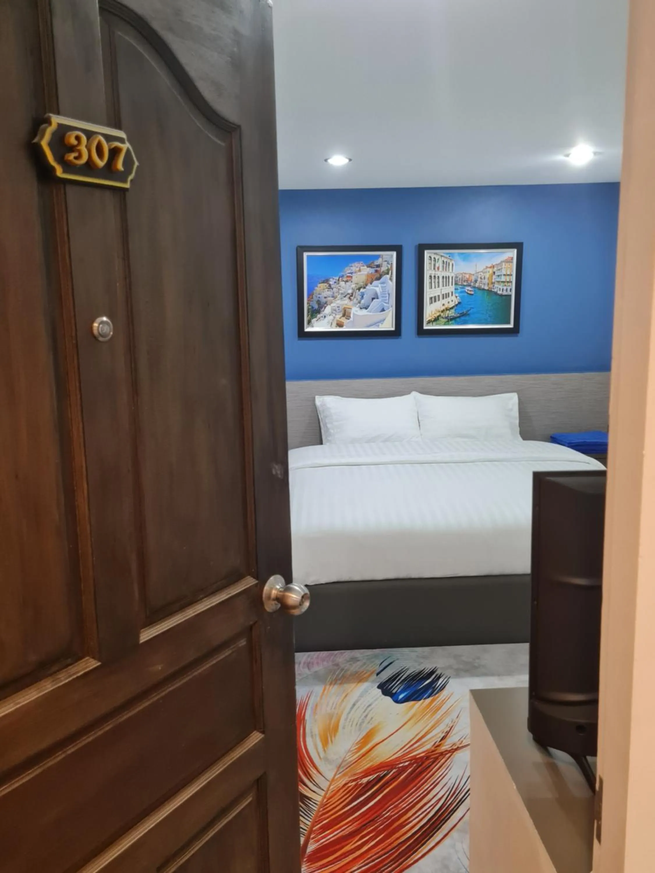 Bed in Poonsuk Place Hotel