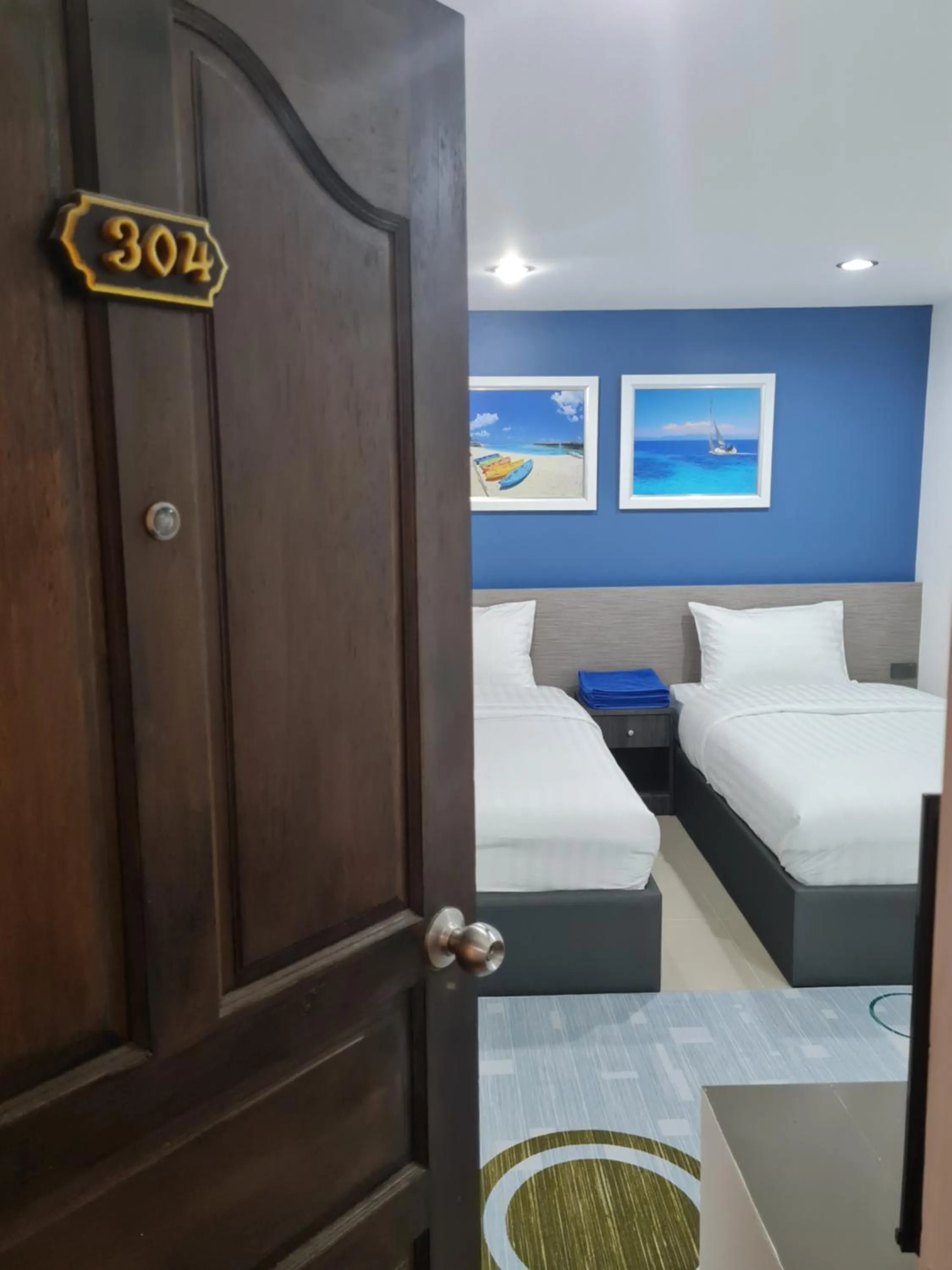 Bed in Poonsuk Place Hotel