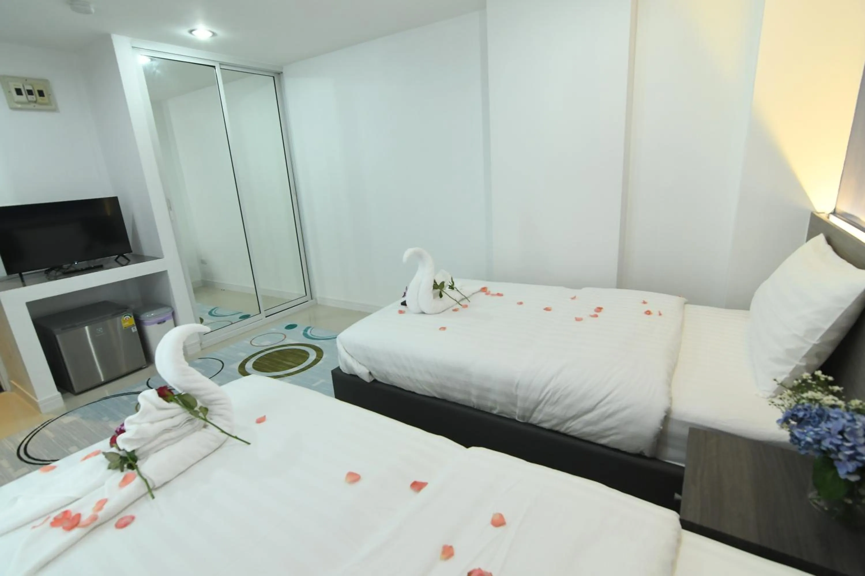 Bed in Poonsuk Place Hotel