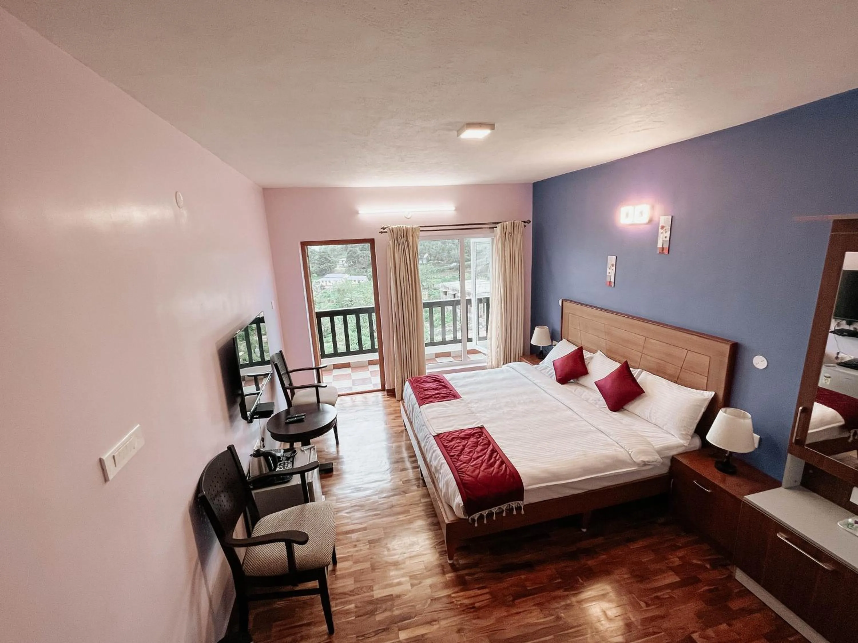 Communal lounge/ TV room, Bed in PURPLE ORCHID BY XACRO XPERIENCES