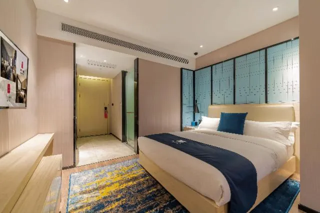 Bed in Echarm Hotel Foshan Guangfo Road Jiaokou Metro Station