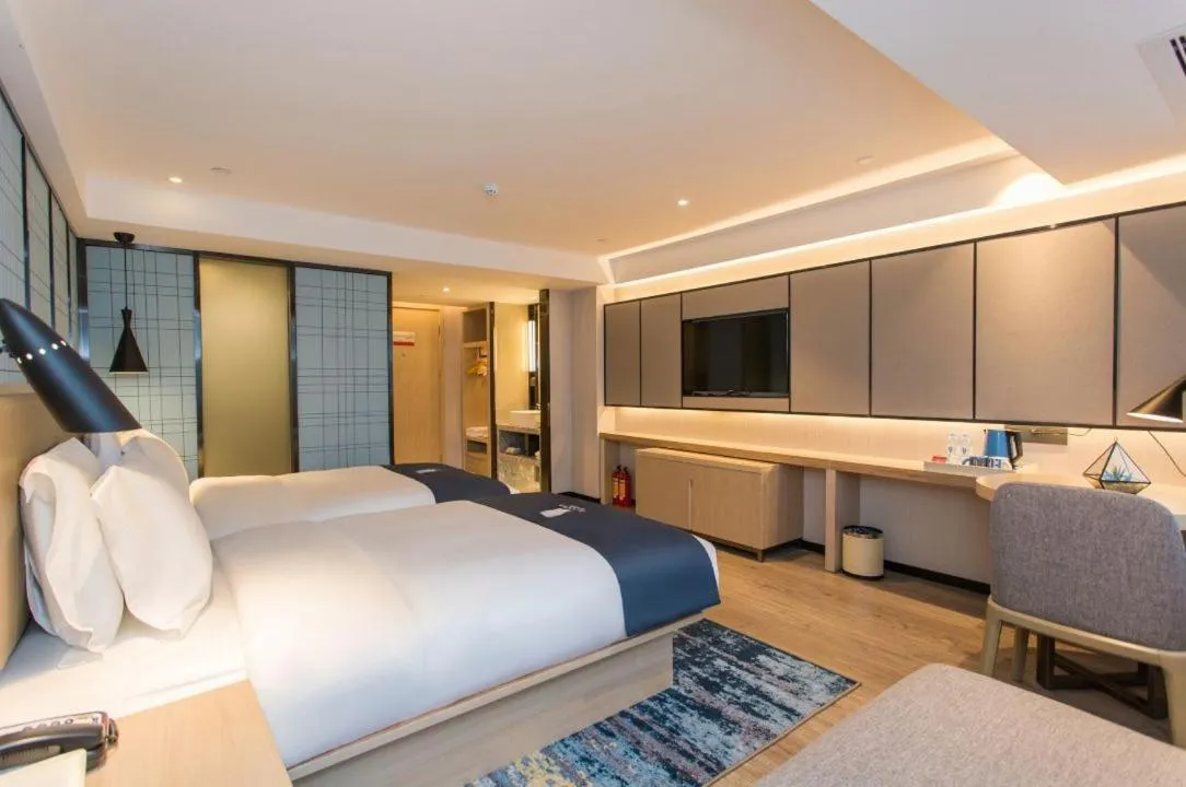 Bed in Echarm Hotel Foshan Guangfo Road Jiaokou Metro Station