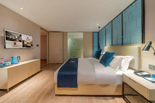 Bed in Echarm Hotel Foshan Guangfo Road Jiaokou Metro Station