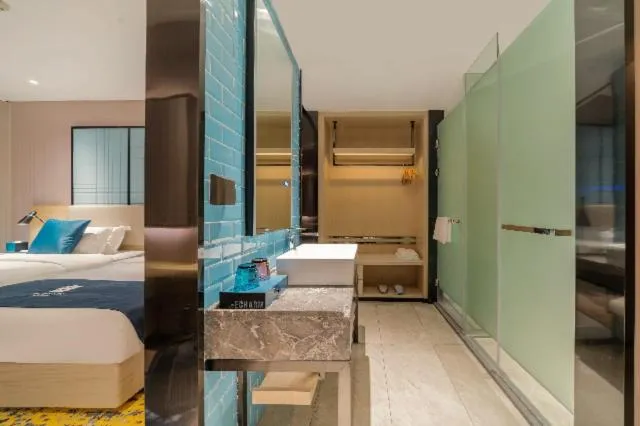 Bed in Echarm Hotel Foshan Guangfo Road Jiaokou Metro Station