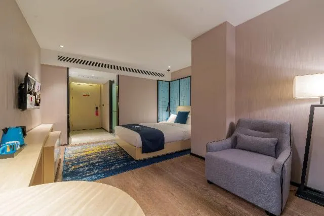 Bed in Echarm Hotel Foshan Guangfo Road Jiaokou Metro Station