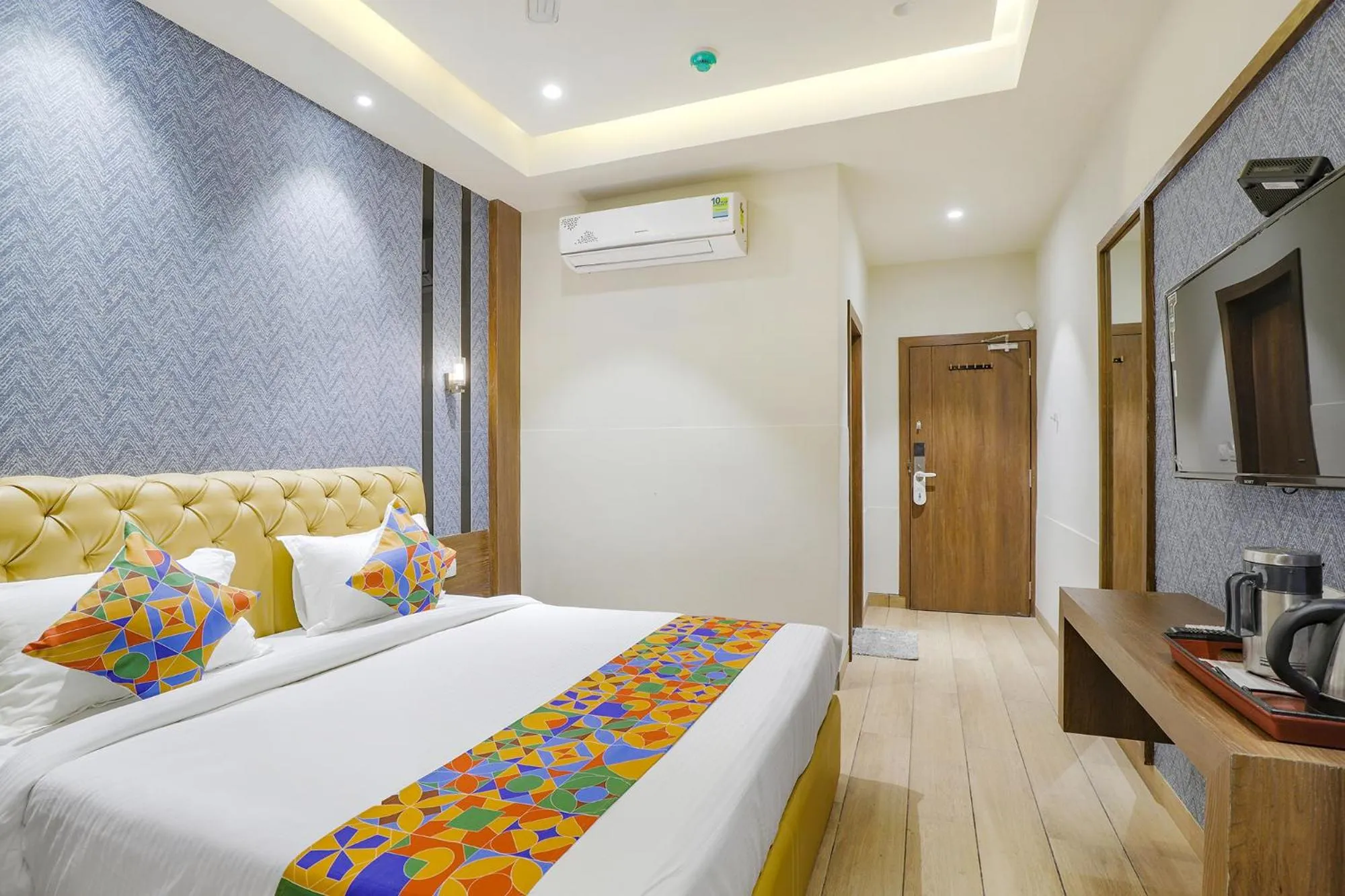 Bed in FabHotel Meritus Inn