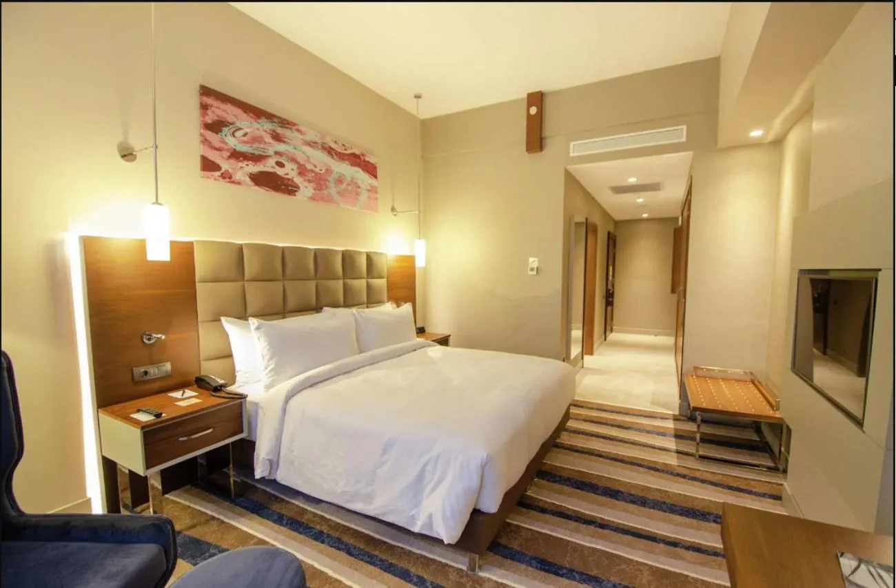TV and multimedia, Bed in Questa Thermal & Spa Hotel