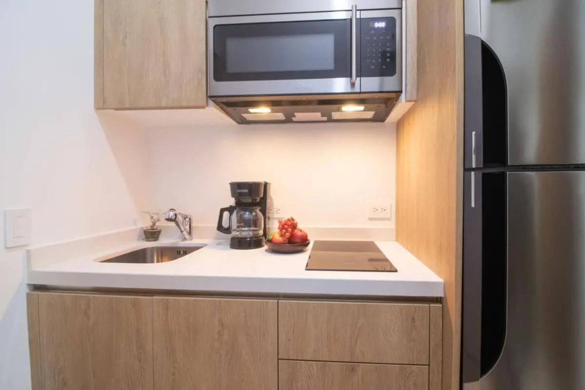 Kitchen or kitchenette in Oceanview Infinity Pool, Steps to 5th Ave & Beach