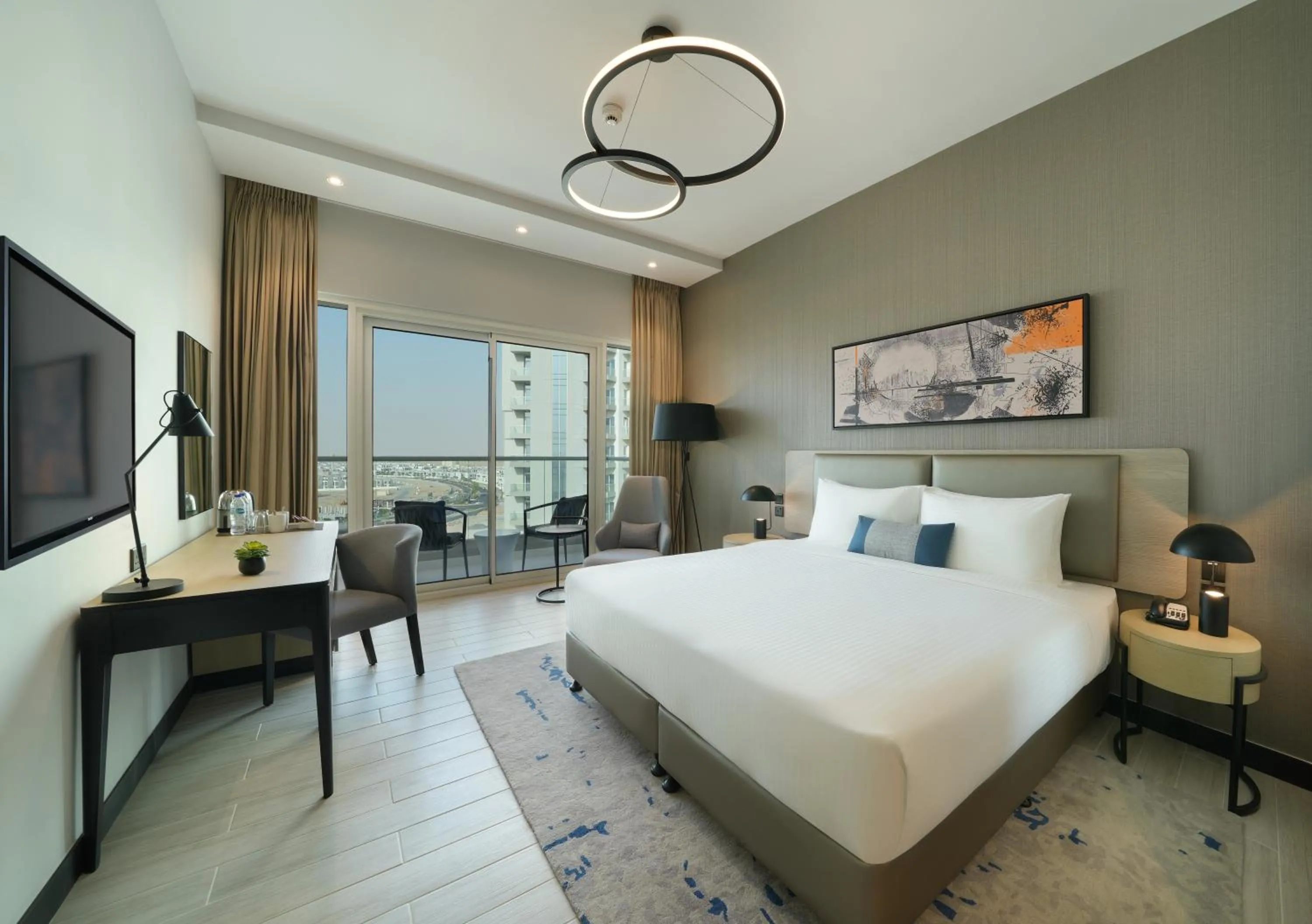 Bed in DAMAC Hills 2 Hotel, an Edge by Rotana Hotel