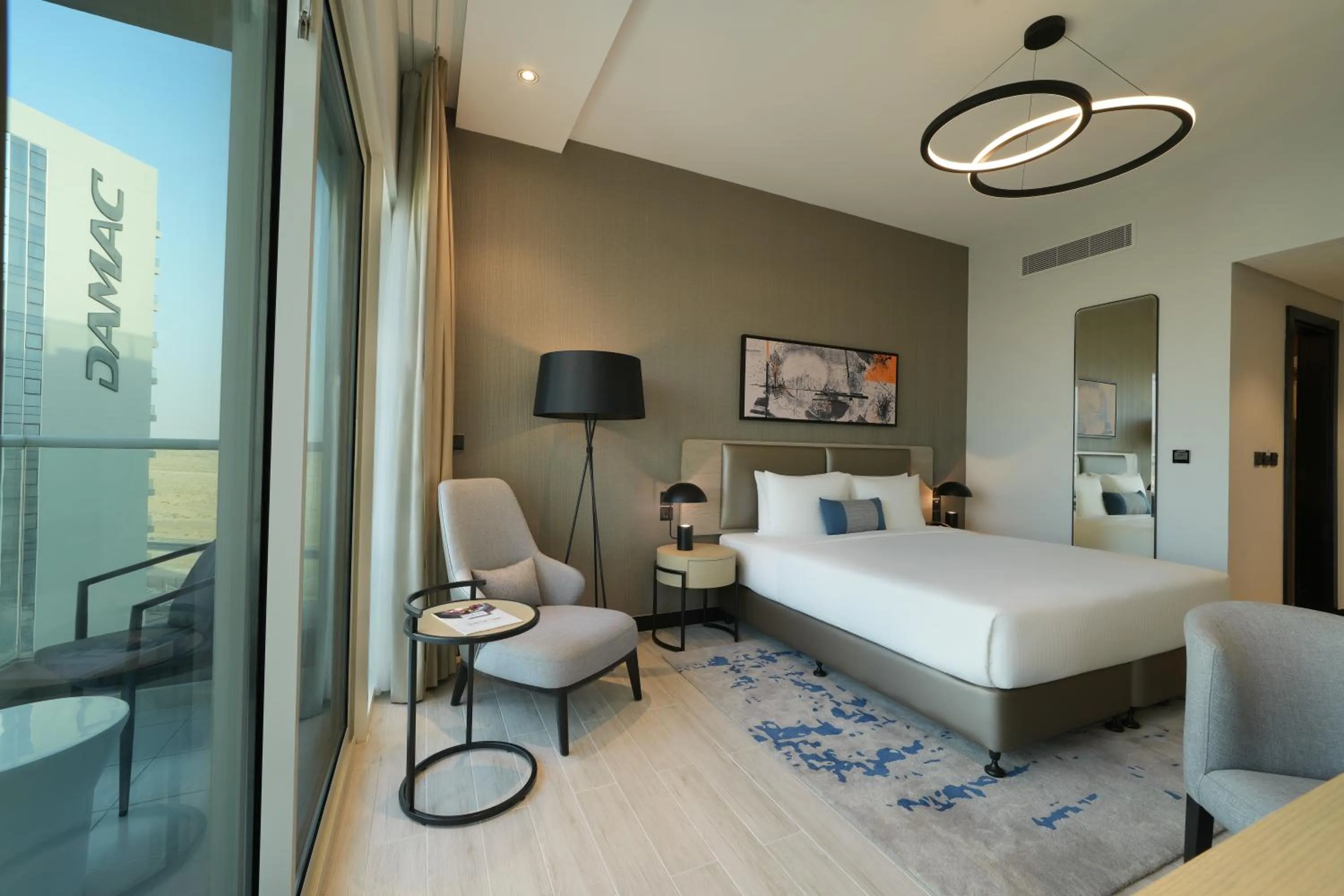 Bed in DAMAC Hills 2 Hotel, an Edge by Rotana Hotel