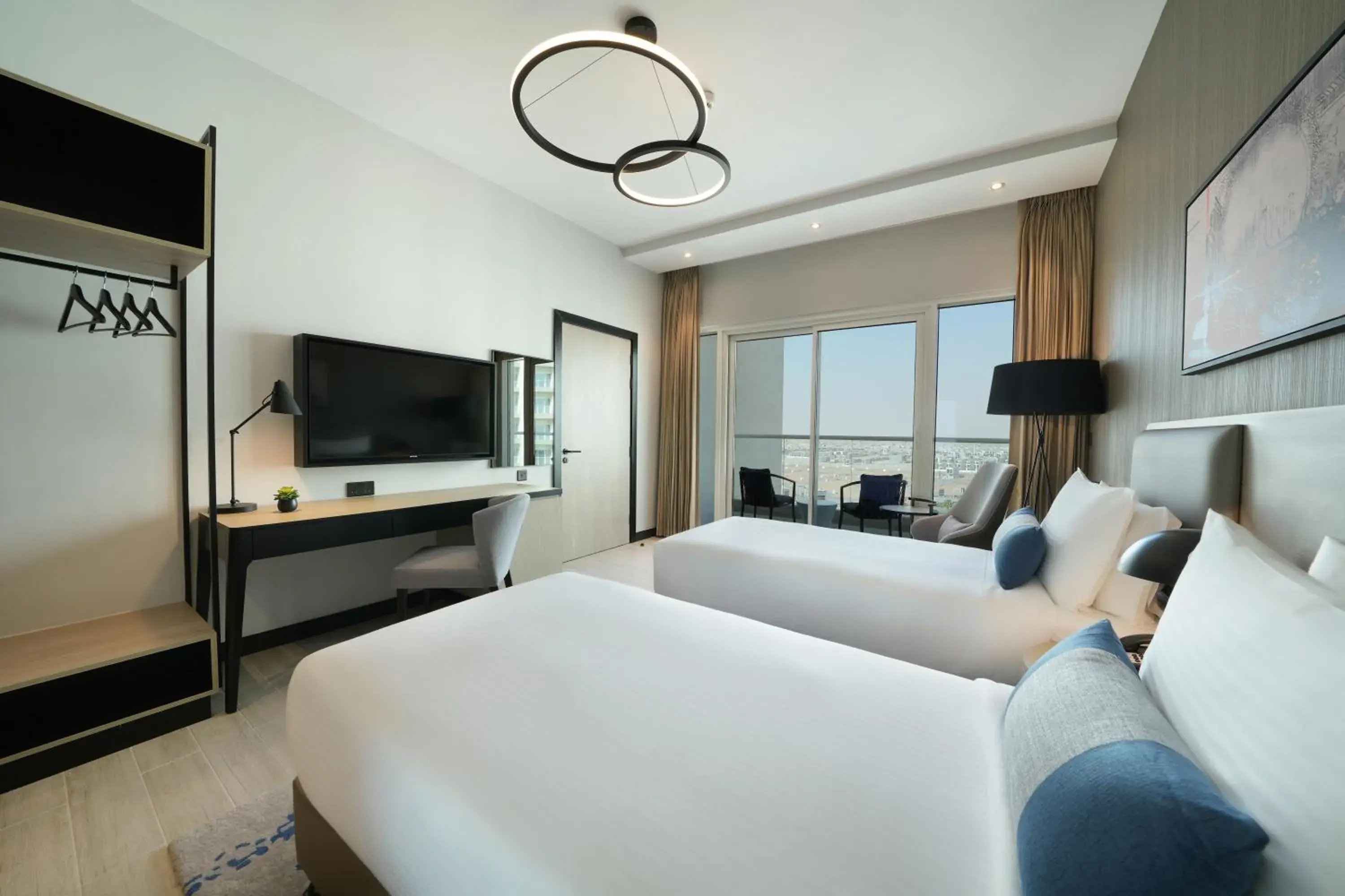 Family Connecting Rooms – King & Twin Beds in DAMAC Hills 2 Hotel, an Edge by Rotana Hotel Family Connecting Rooms – King & Twin Beds in DAMAC Hills 2 Hotel, an Edge by Rotana Hotel