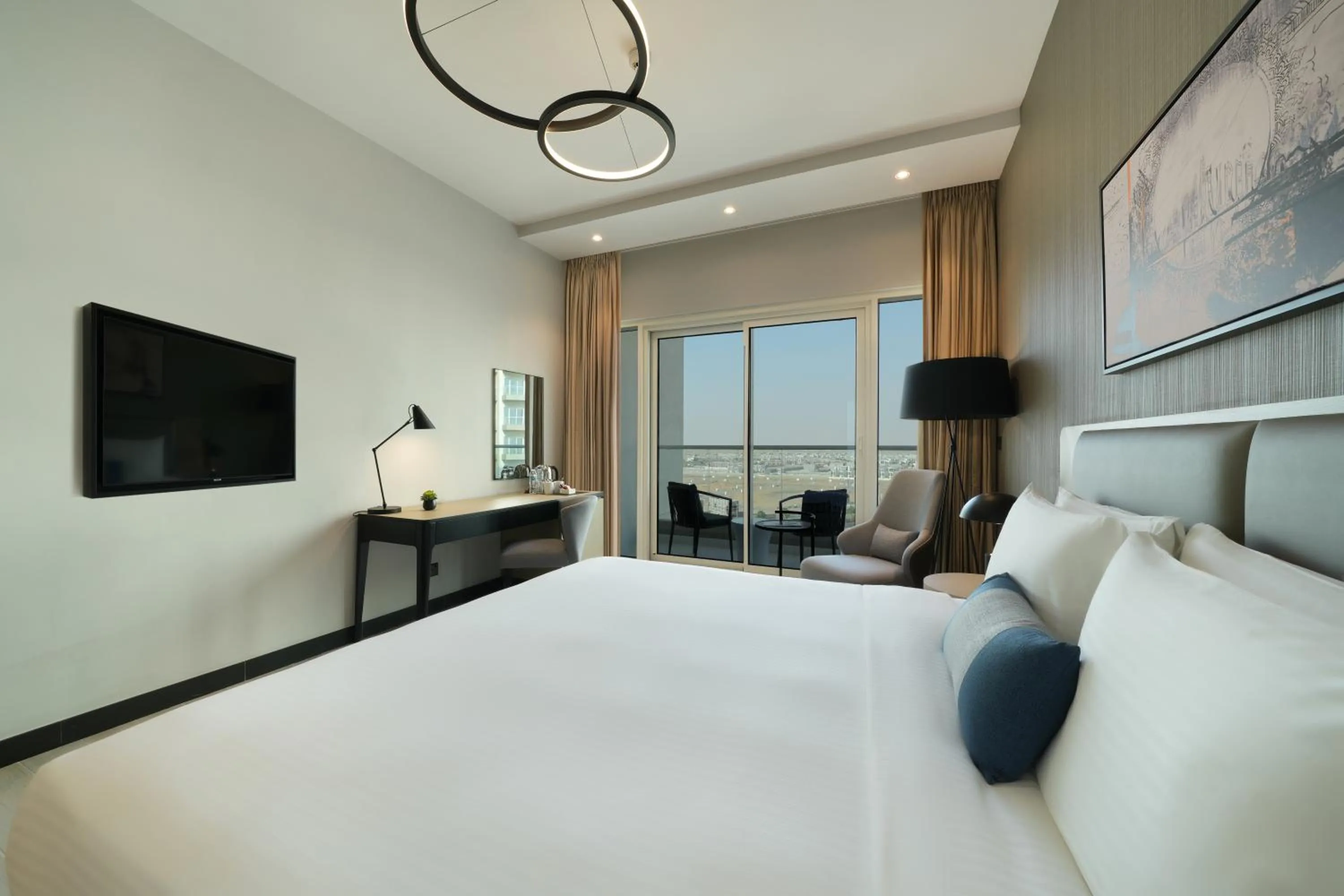 Bed in DAMAC Hills 2 Hotel, an Edge by Rotana Hotel