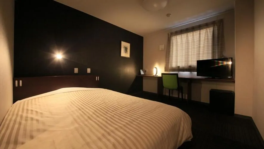 Bed in Hotel Coonel Inn