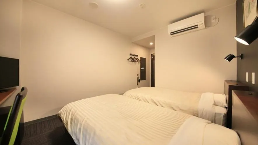 Bed in Hotel Coonel Inn