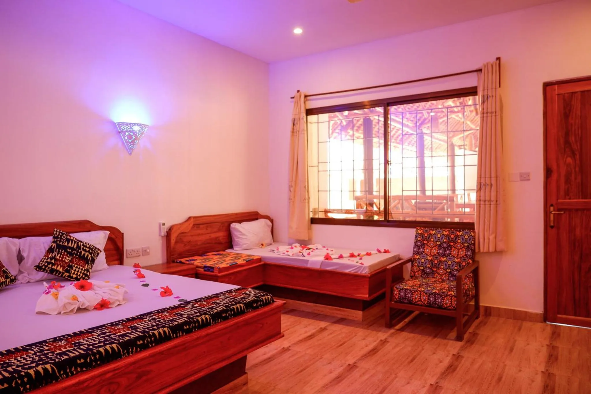 Photo of the whole room, Bed in Nungwi Heritage Resort