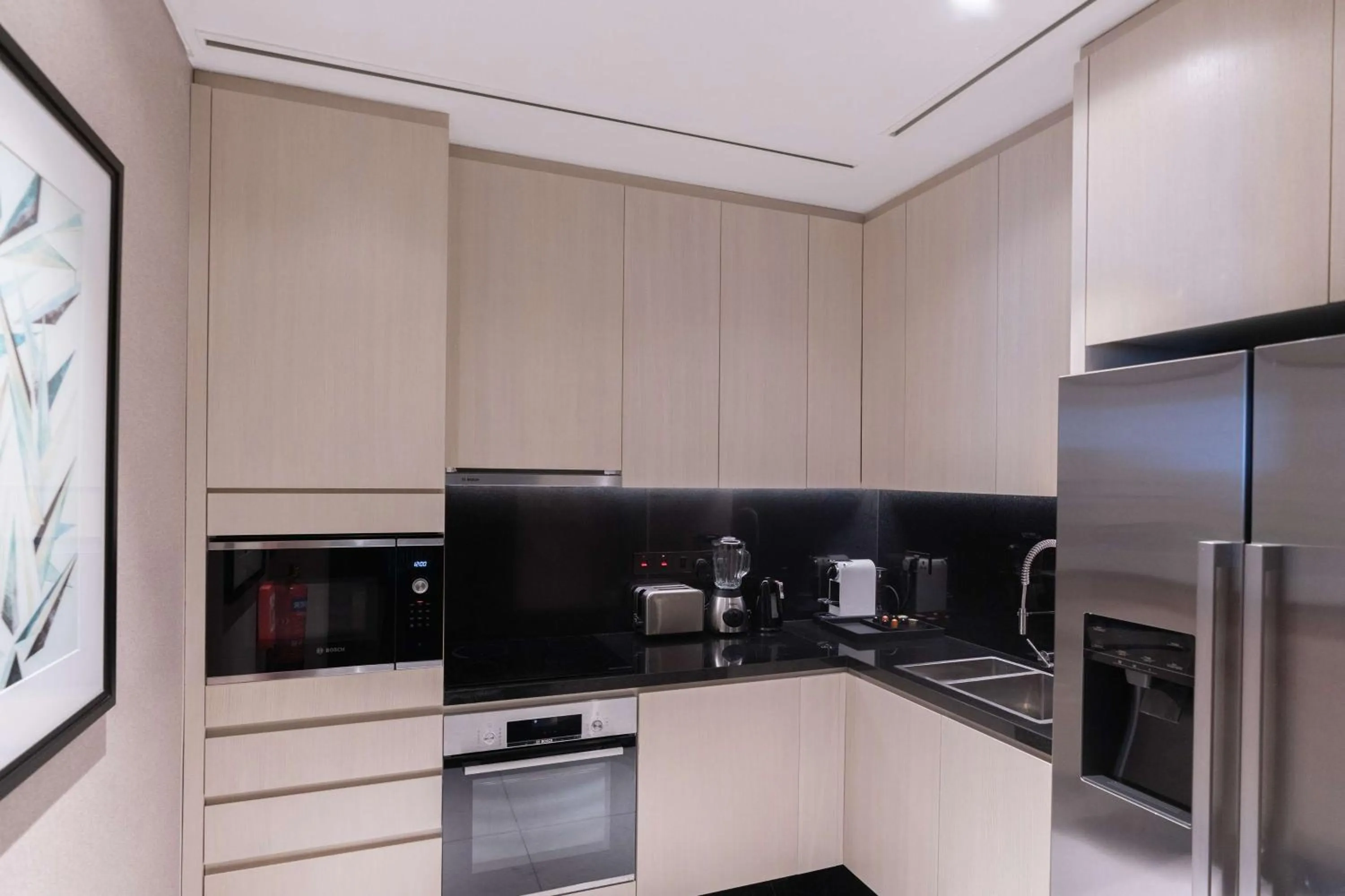 Kitchen or kitchenette in Waldorf Astoria Doha West Bay