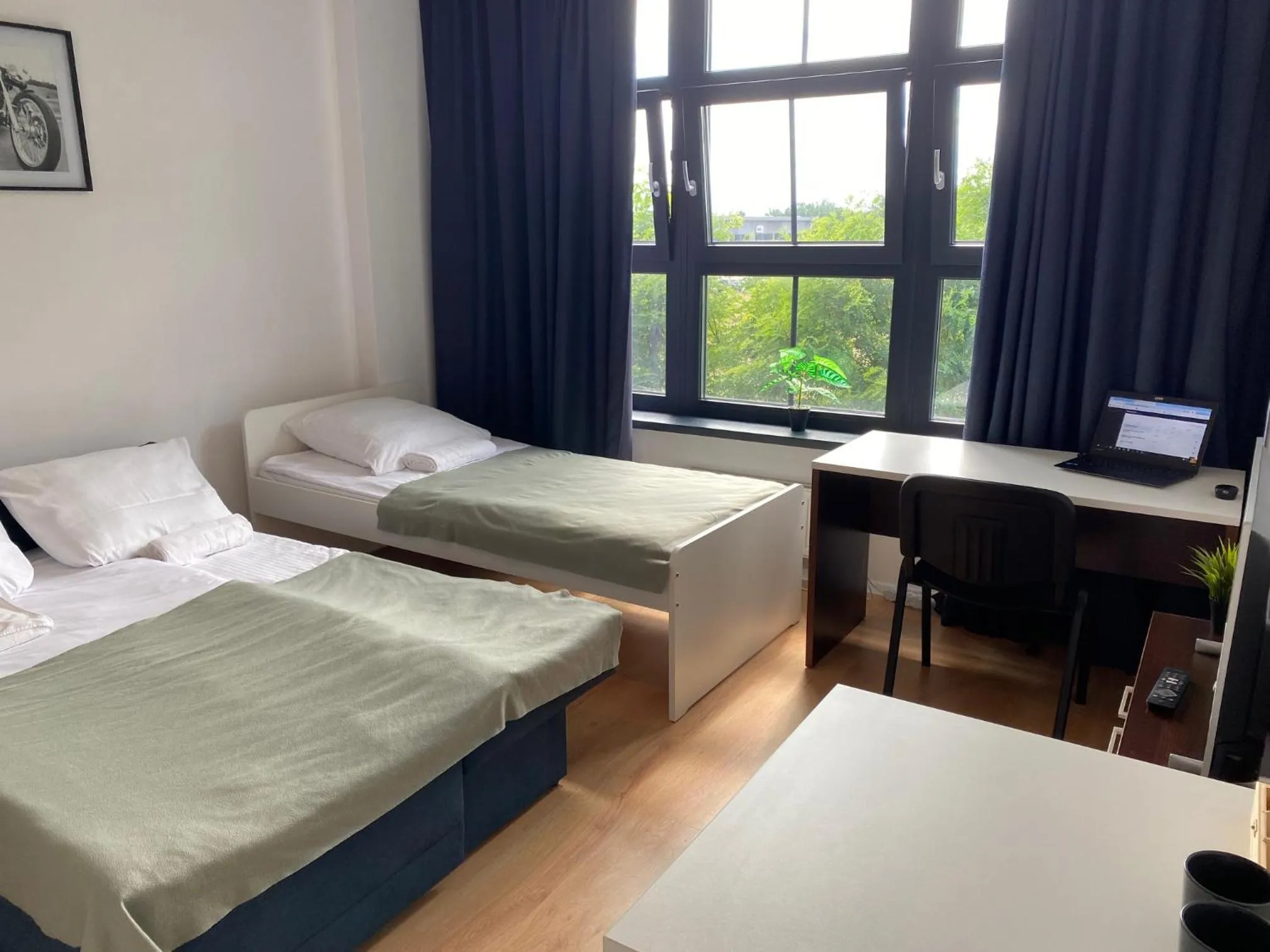 Bed in SleepWell Apartments